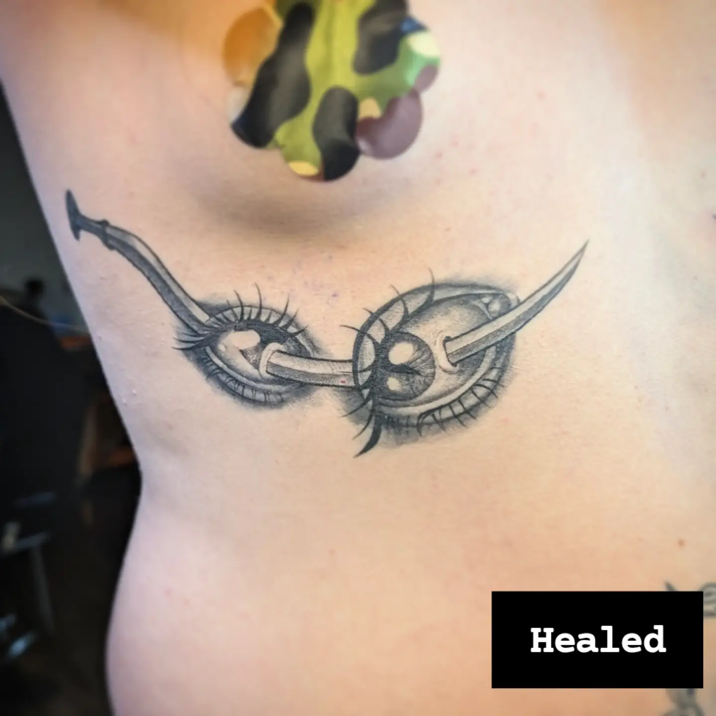 Eye with sword black and grey tattoo on the chest by Jo Xylo - Minneapolis Tattoo Artist, Minneapolis, Minnesota