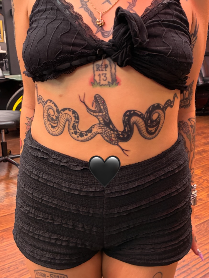 Snake black and grey tattoo on the torso by Elliot Jaye Valentine