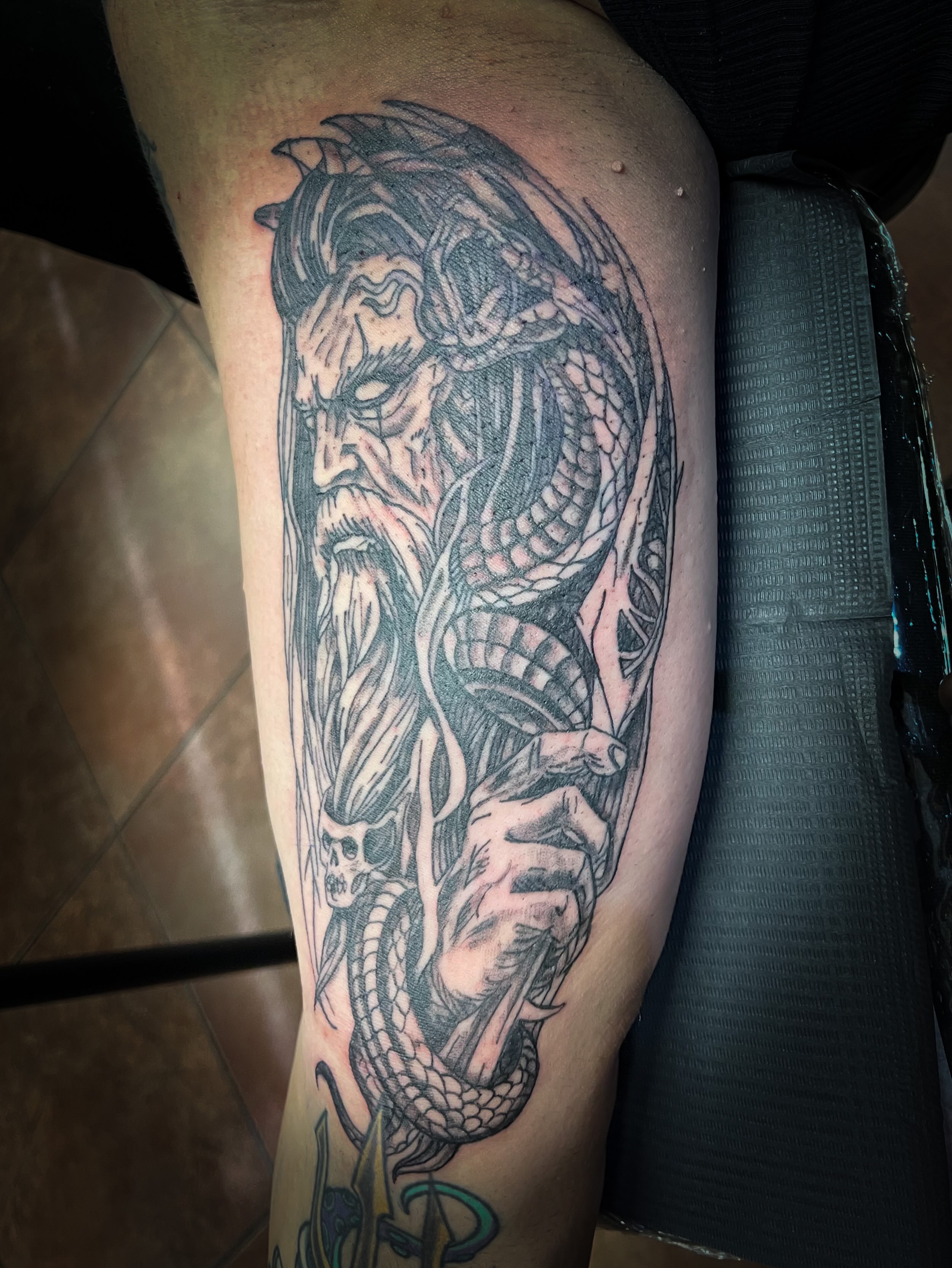 Bearded man with dragon realism tattoo on the forearm by Melissa Peña NYC