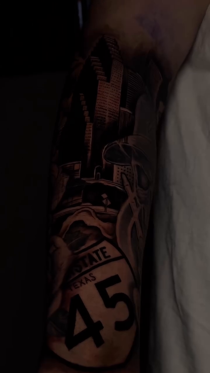 Cityscape with roses and route marker realism tattoo by Thomas