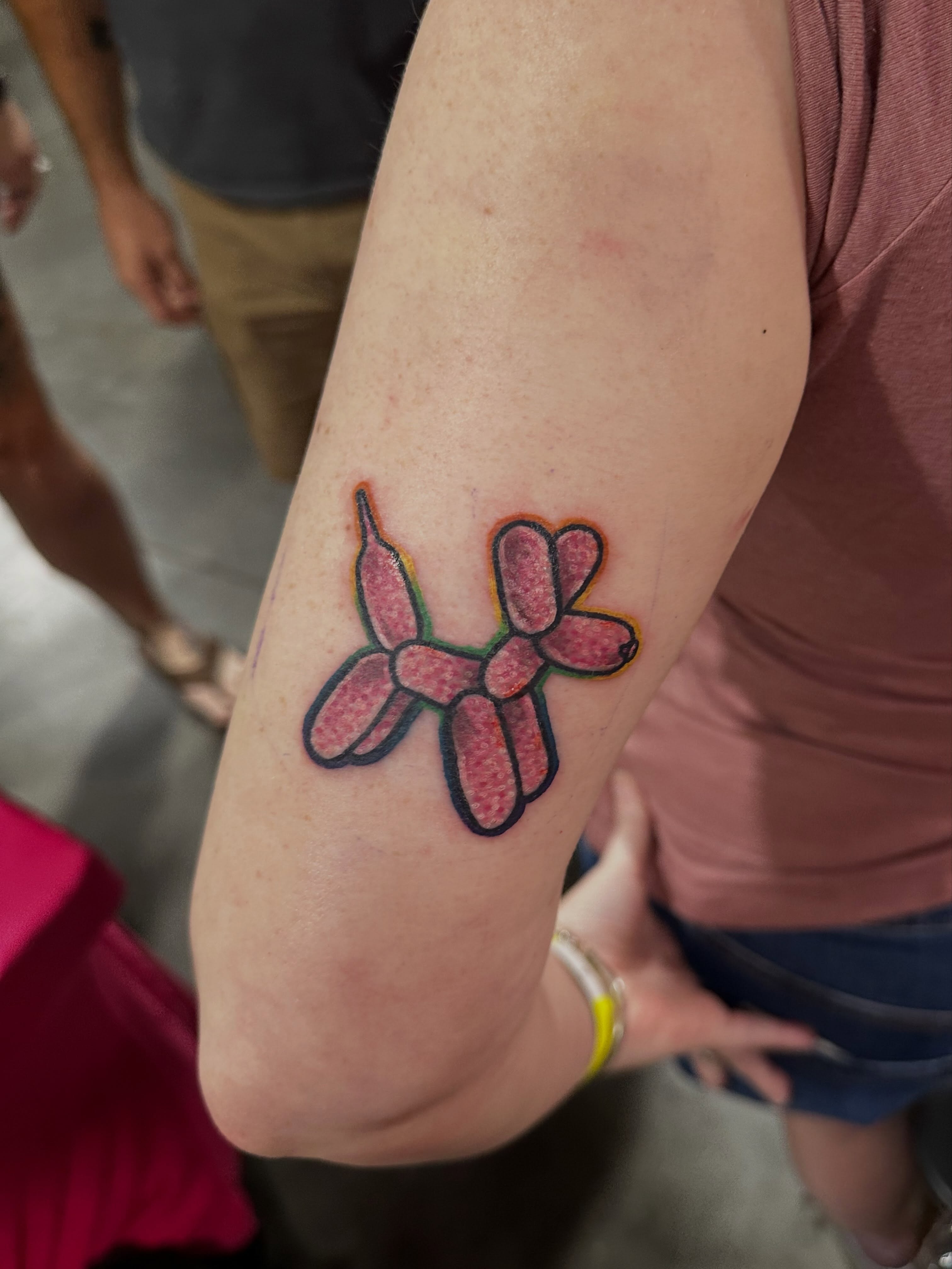 Balloon animal new school tattoo on the forearm by Erin Miller