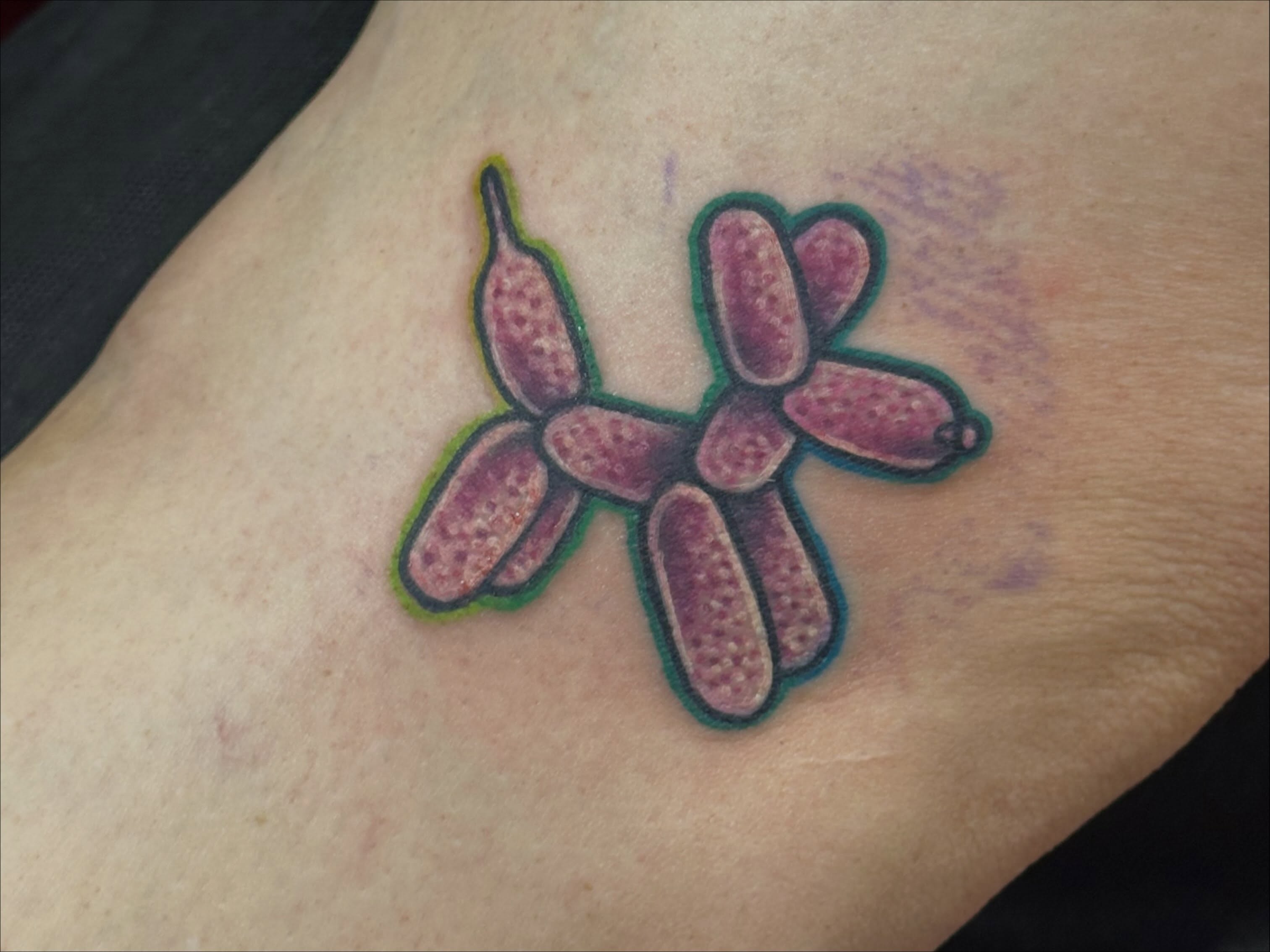 Balloon animal dotwork tattoo on the forearm by Erin Miller