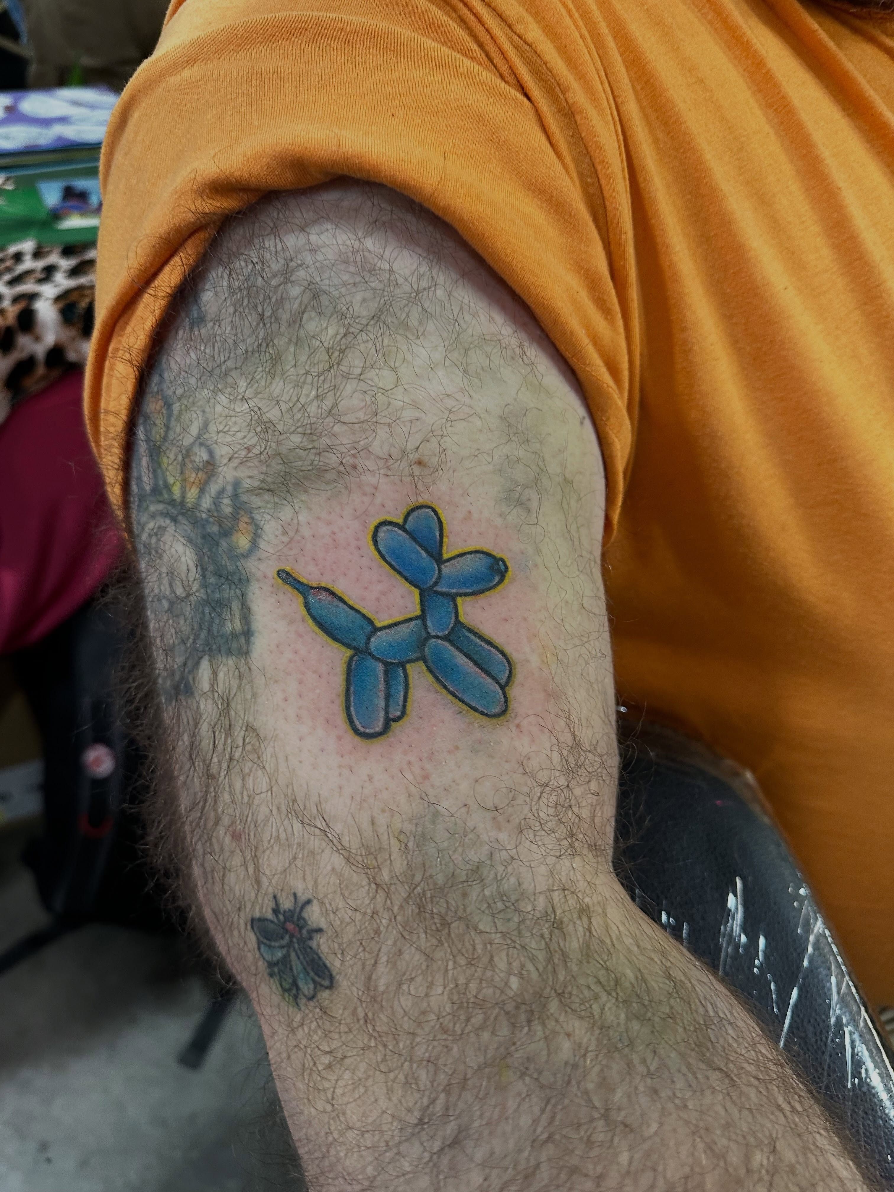 Balloon animal new school tattoo on the forearm by Erin Miller