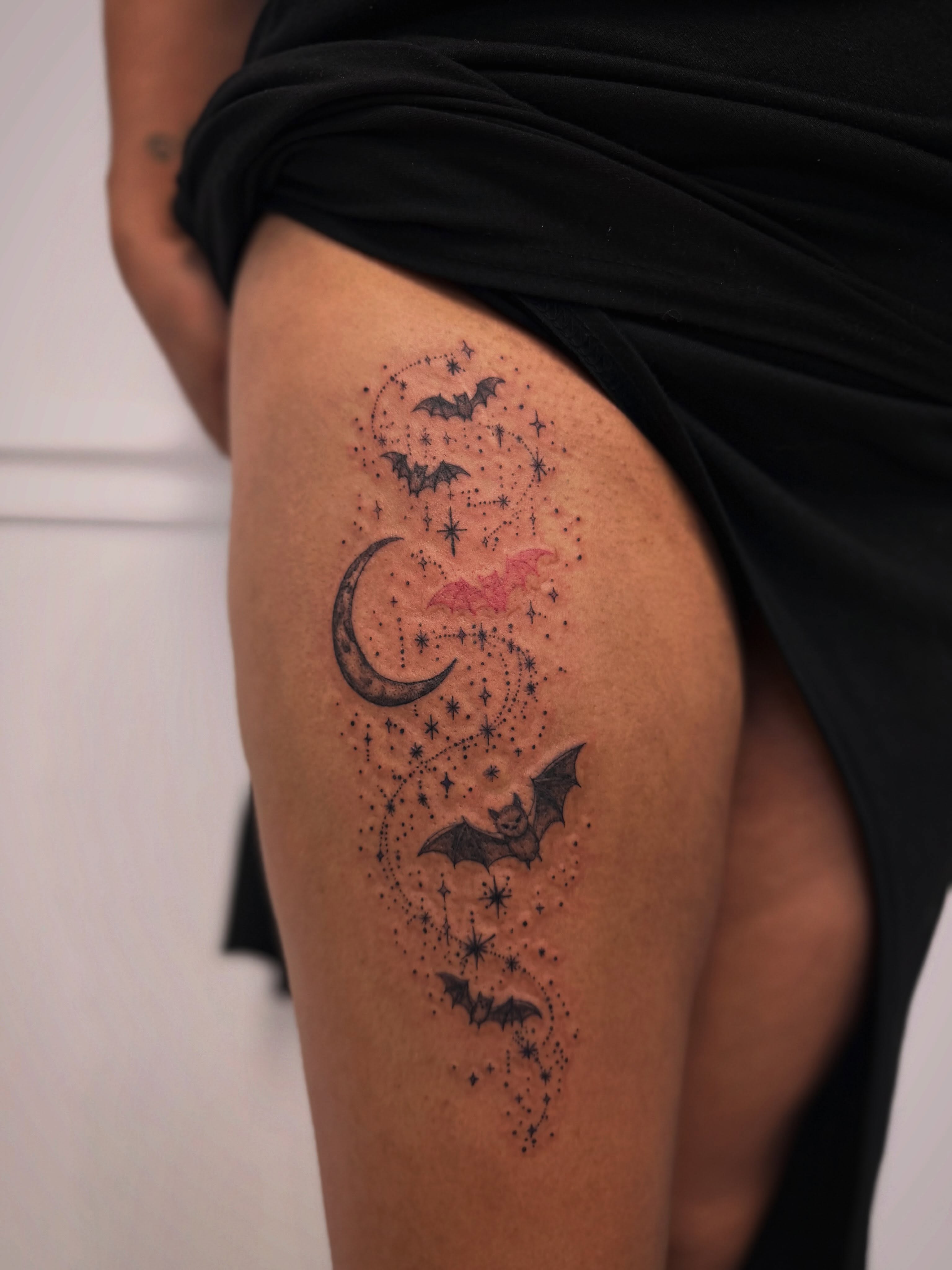 Bats and crescent moon dotwork tattoo on the thigh by Taylor Johnson