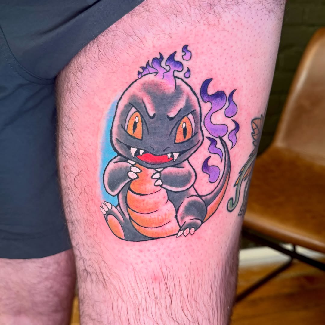 Charizard new school tattoo on the thigh by Zac Smith-Chevalier