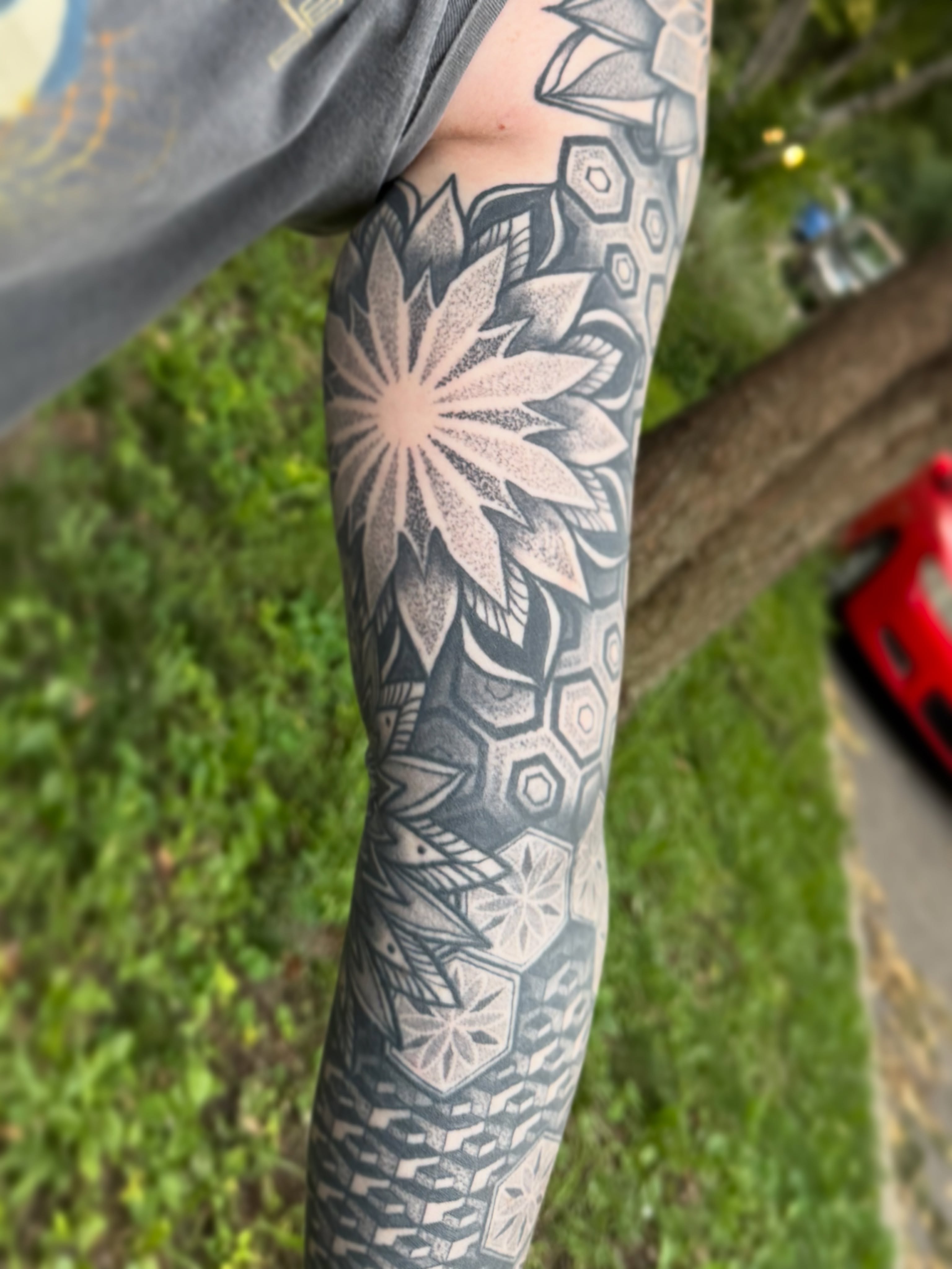 Geometric floral pattern dotwork tattoo on the forearm by Jaxson Eugene Brady-Hobart