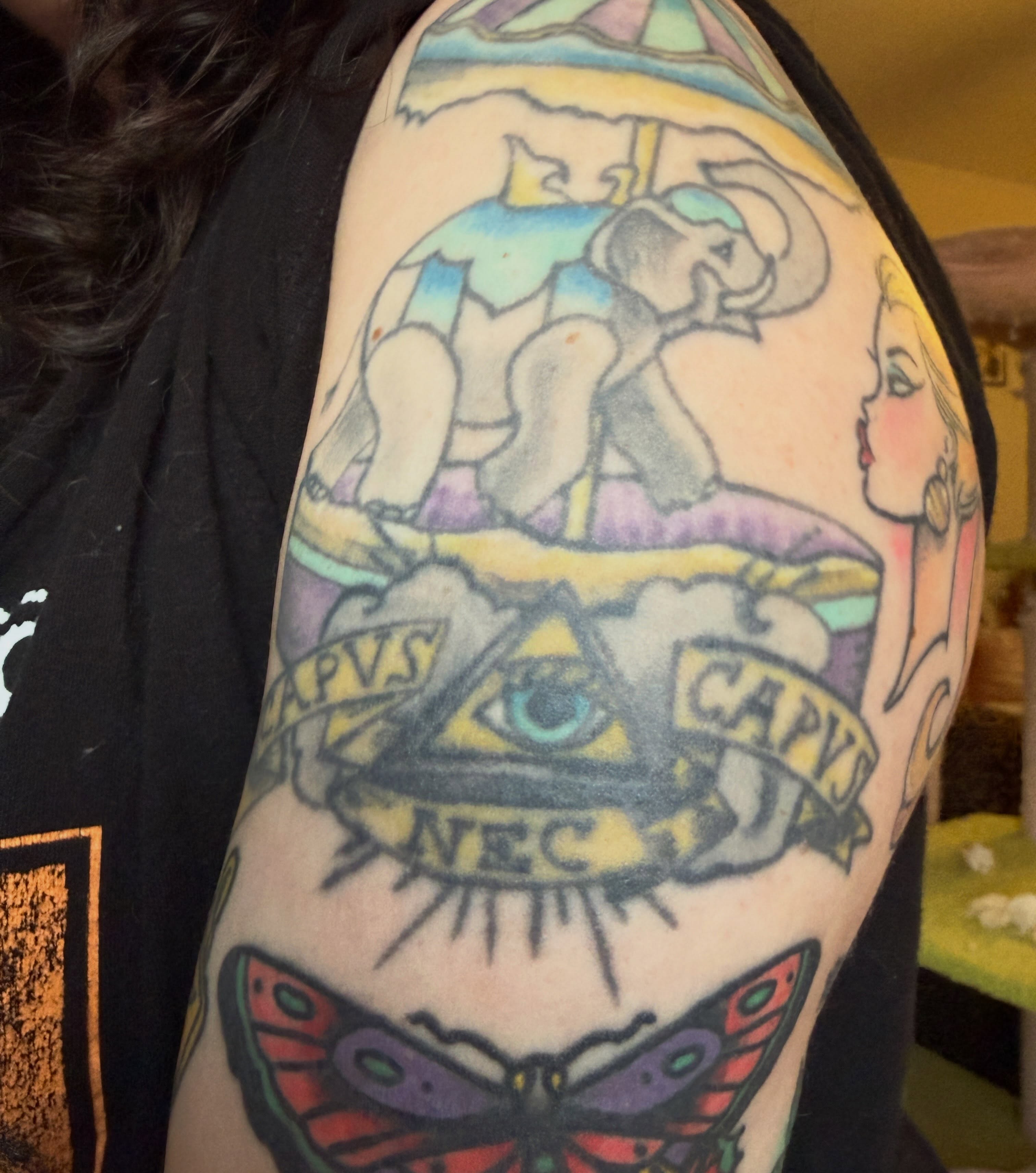 Elephant and woman American traditional tattoo on the shoulder by jessica valentine