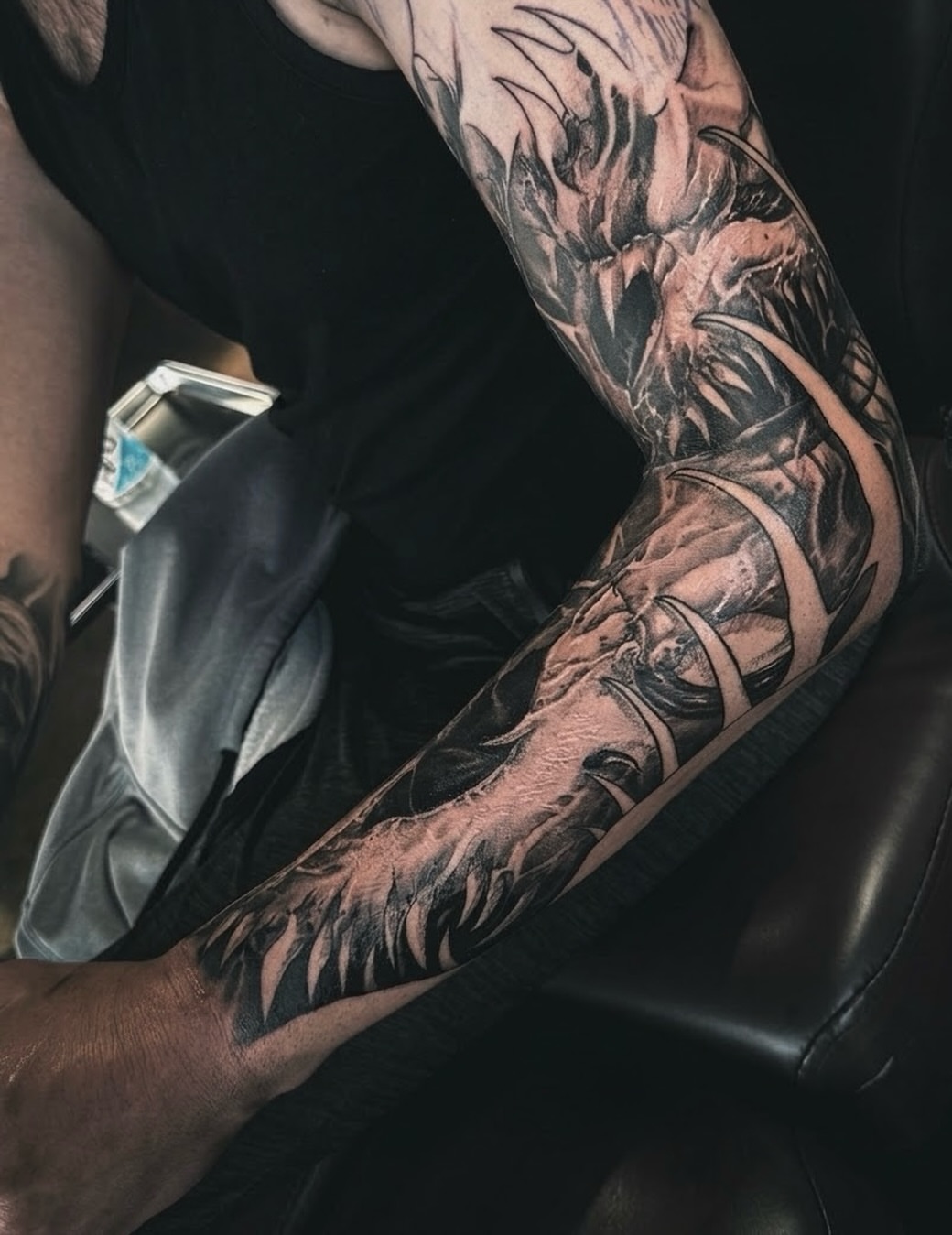 Flames and dragon realism tattoo on the forearm by Miles Haysmith