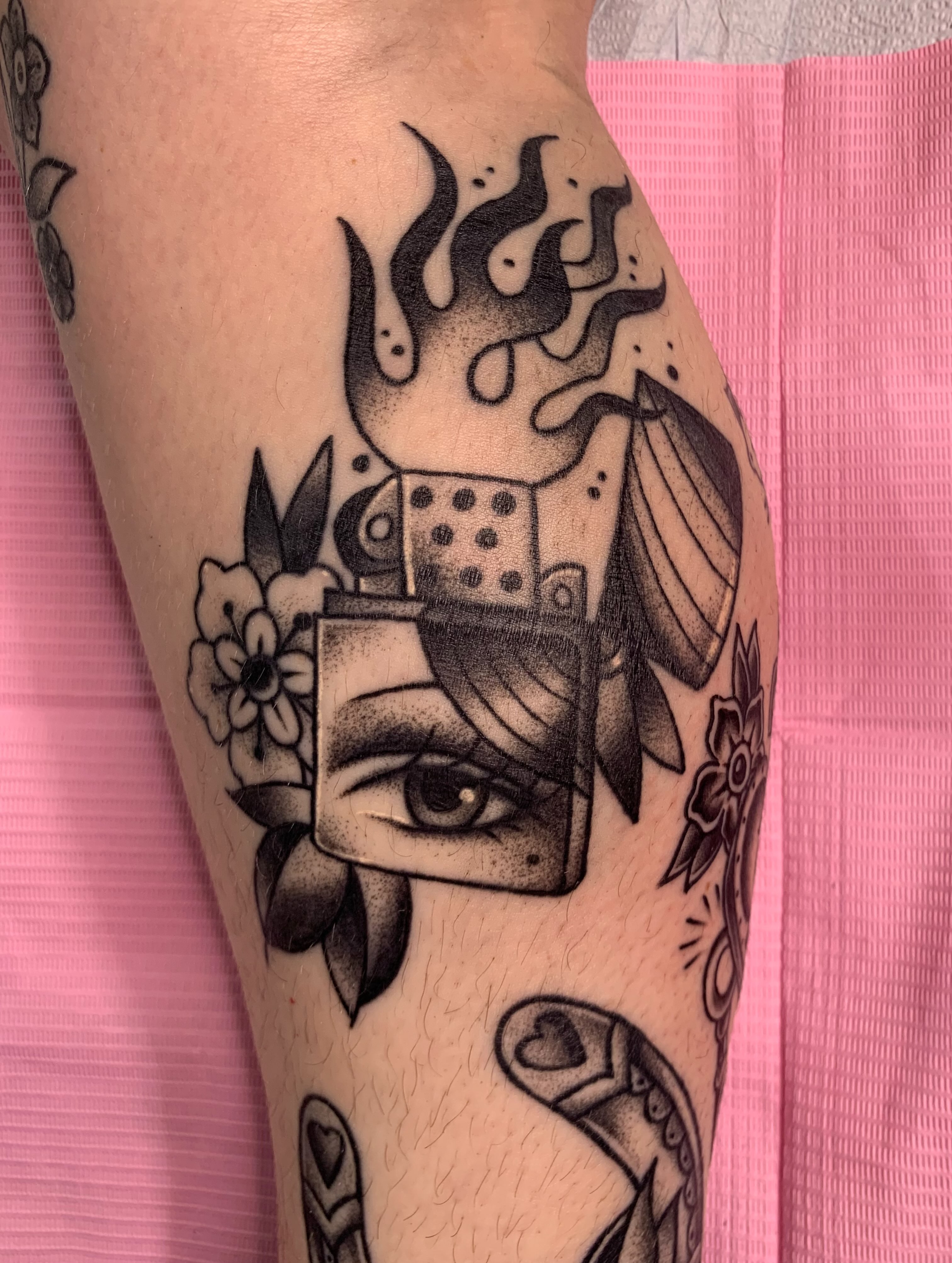 Eye and dice dotwork tattoo on the forearm by Aubrianna Grisez