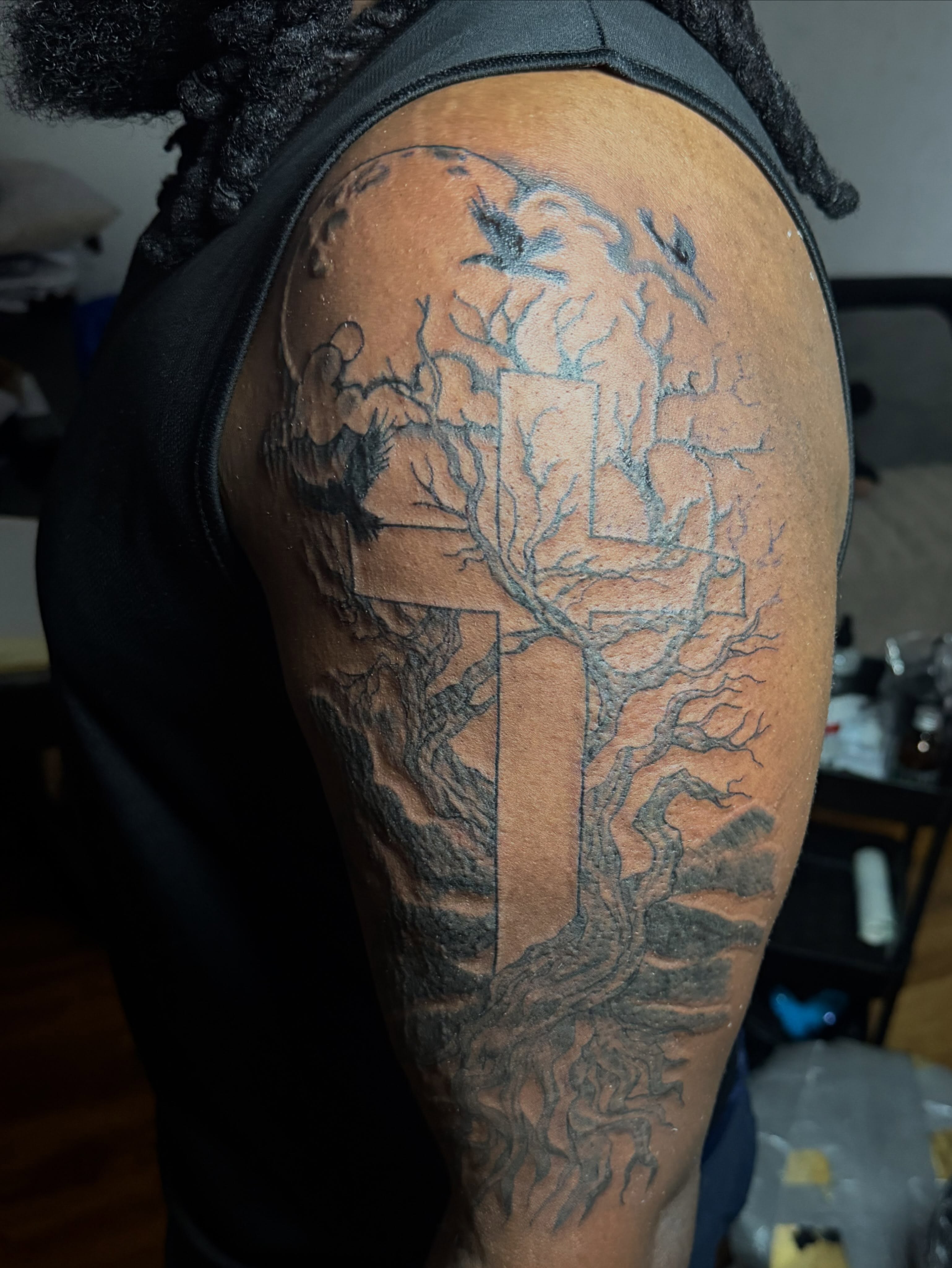 Tree and cross black and grey tattoo on the shoulder by Tcstatts