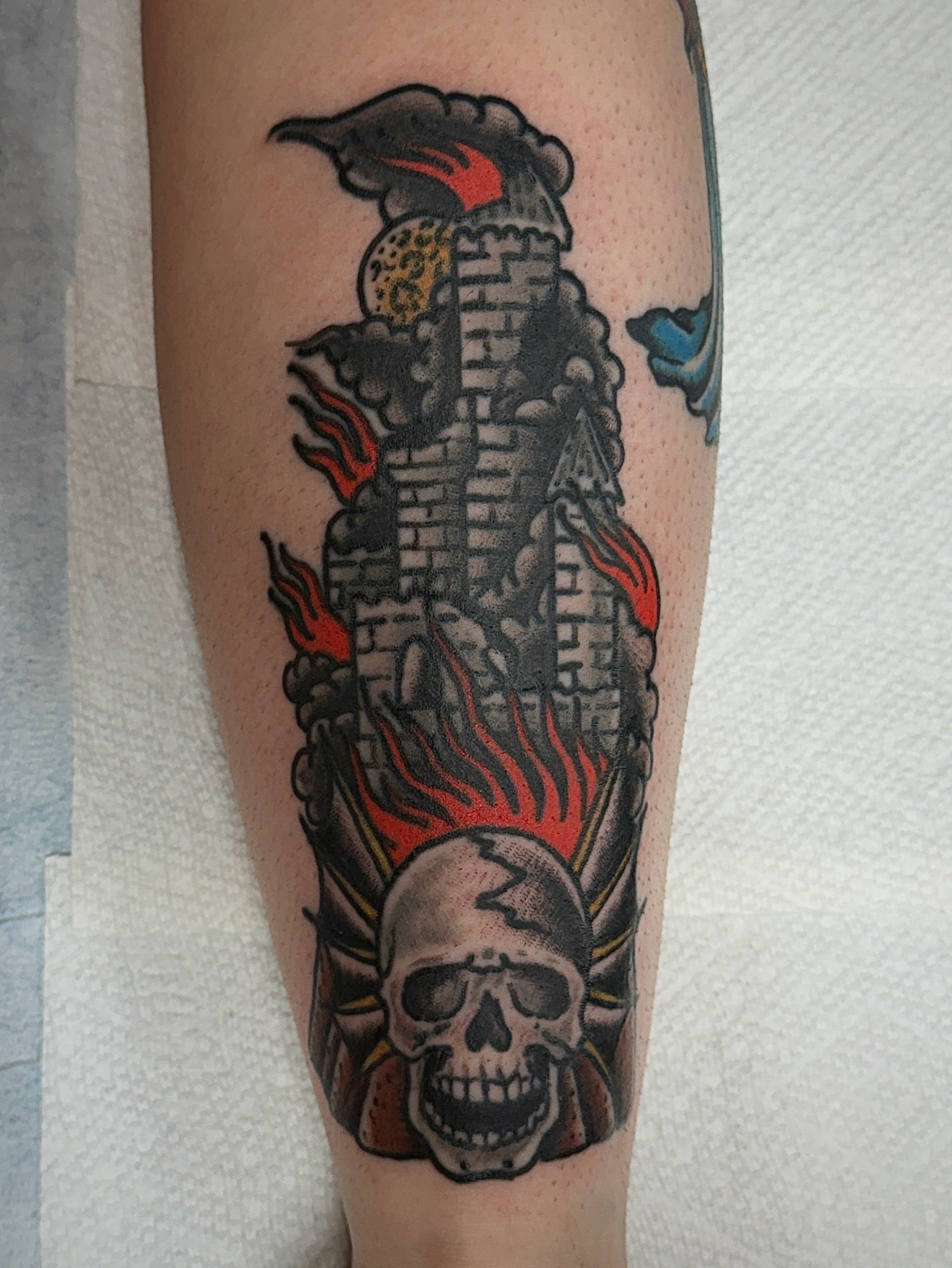 Burning castle with skull American traditional tattoo on the forearm by Patrick Miller, Huber Heights, Ohio