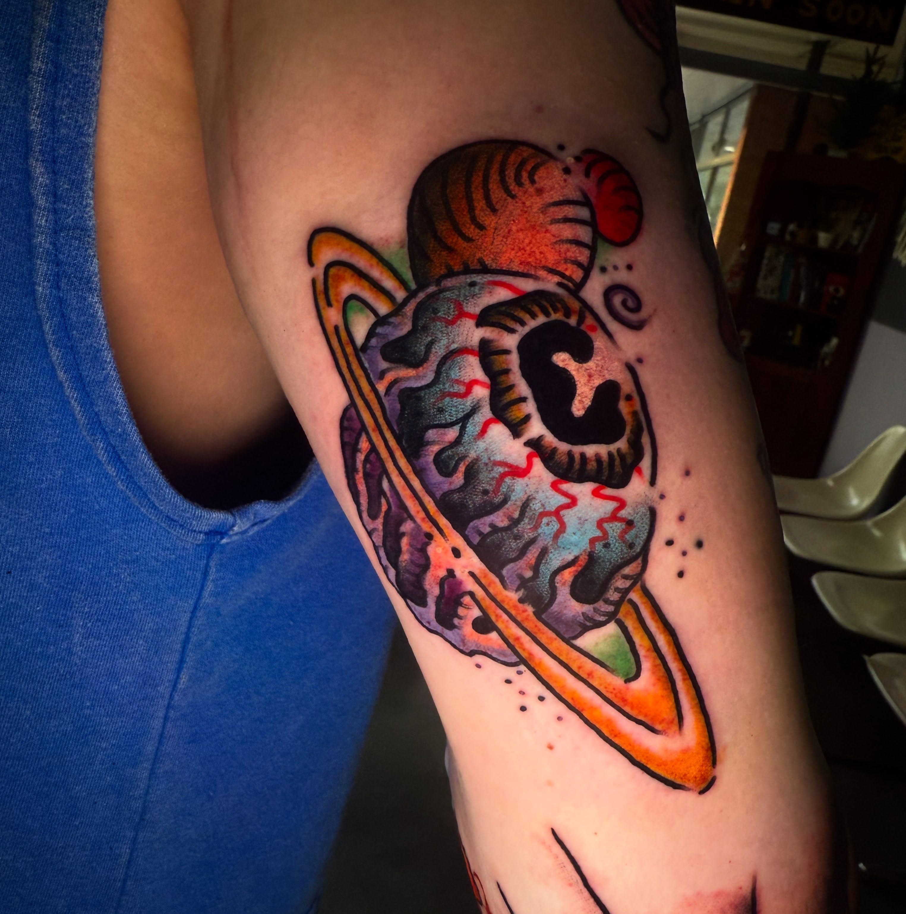 Astronaut brain American traditional tattoo on the forearm by Arron Albaugh