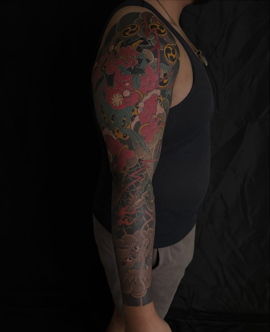 Floral and mythical creature japanese irezumi tattoo on the upper arm by Zach Hendrickson
