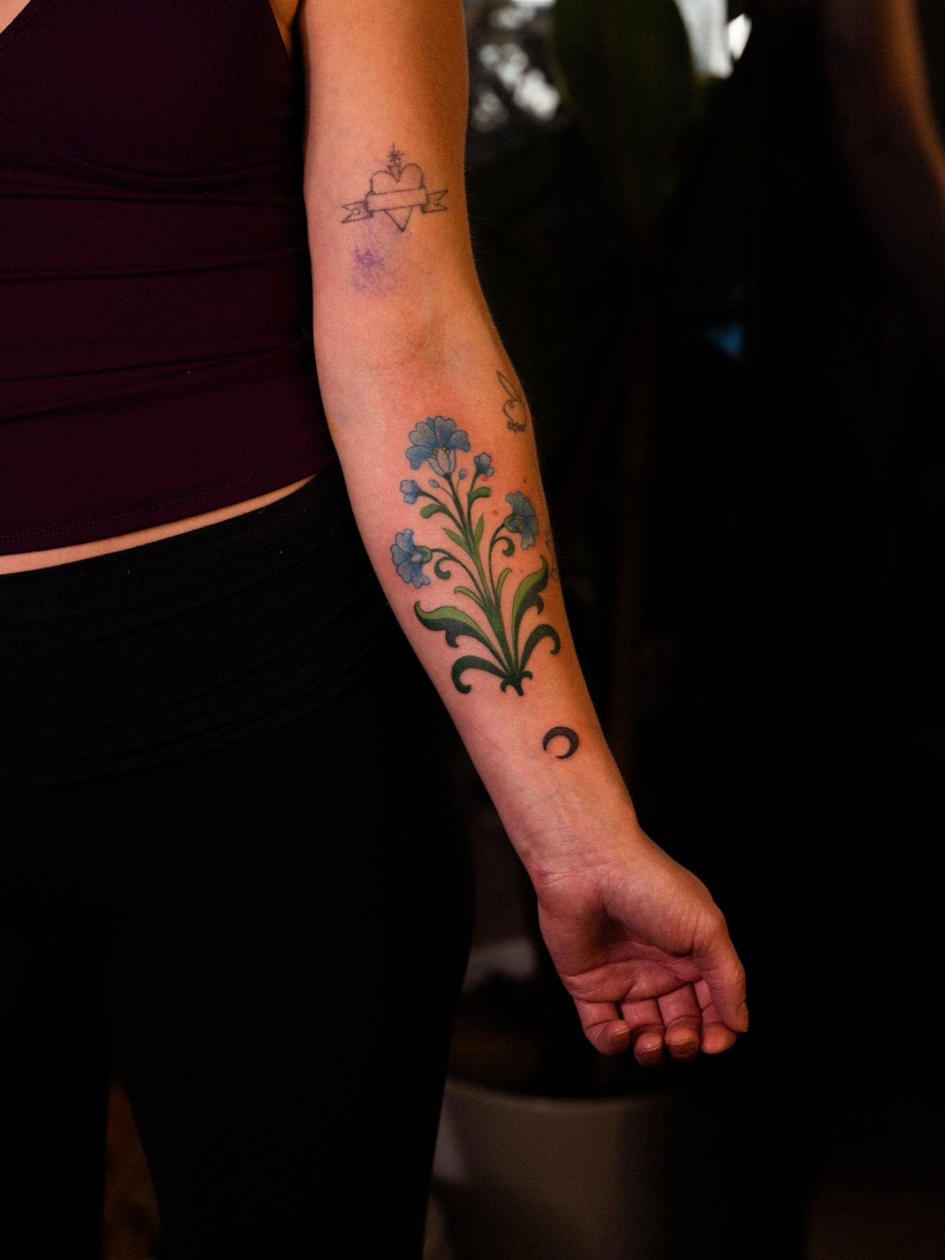Floral design new school tattoo on the forearm by Brad Simmons