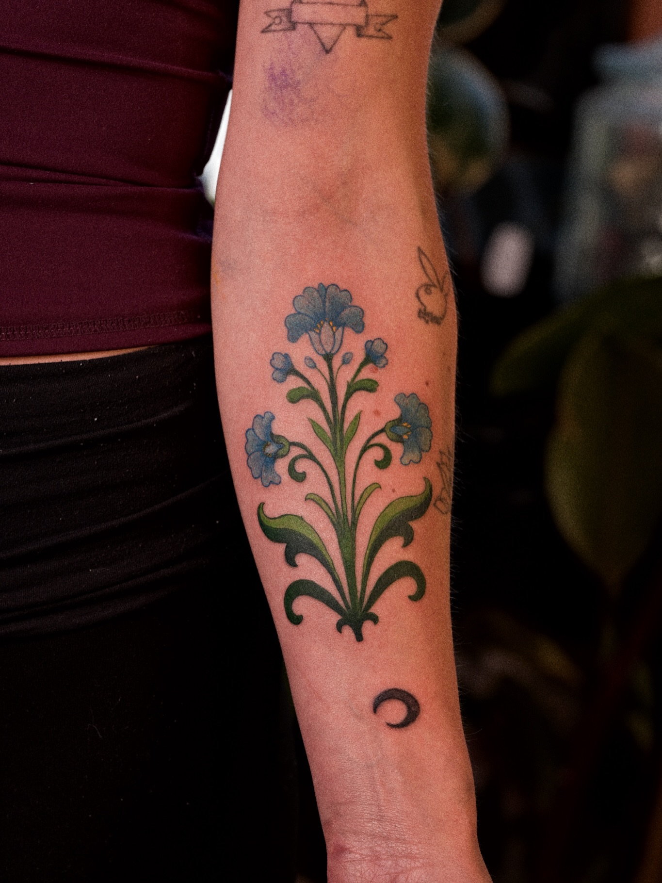 Floral design ornamental tattoo on the forearm by Brad Simmons