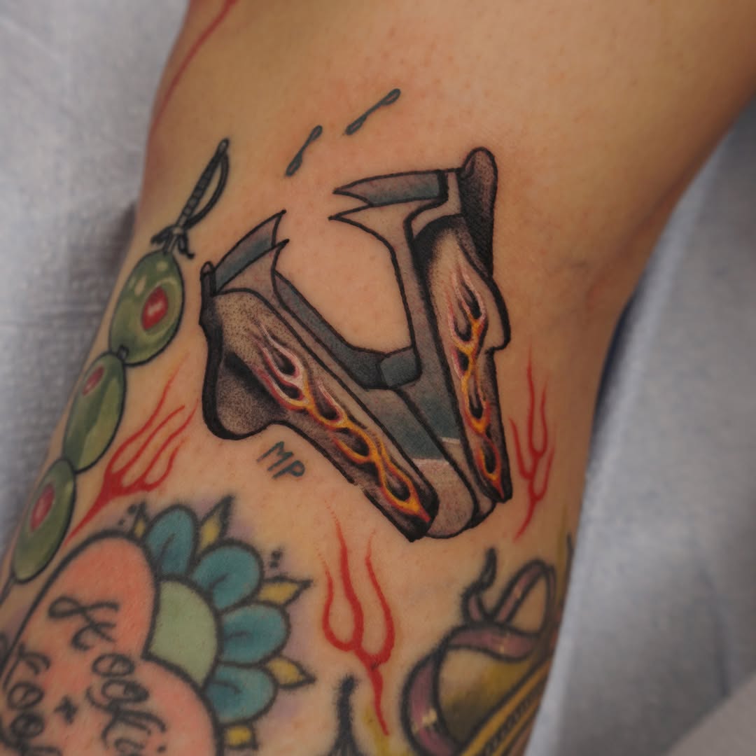 Roller skates American traditional tattoo on the forearm by Sarah Christine Tattoo, Calgary, Alberta