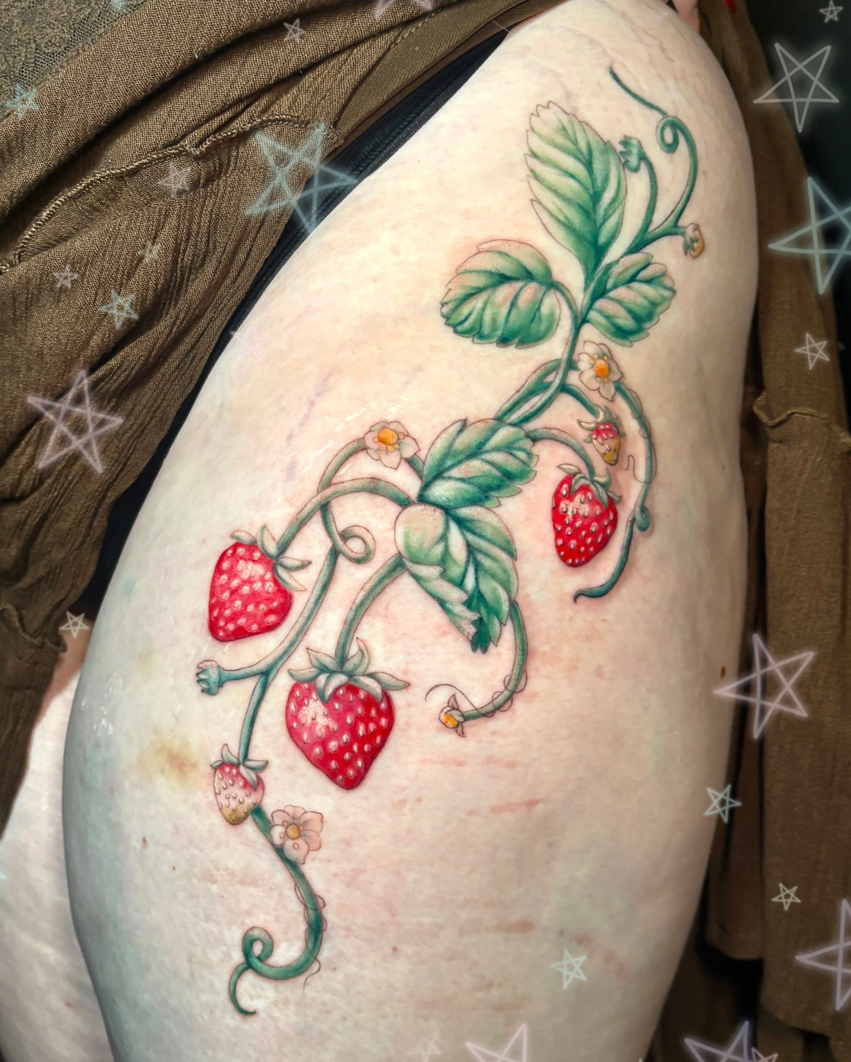 Strawberry vine realism tattoo on the thigh by Autumn