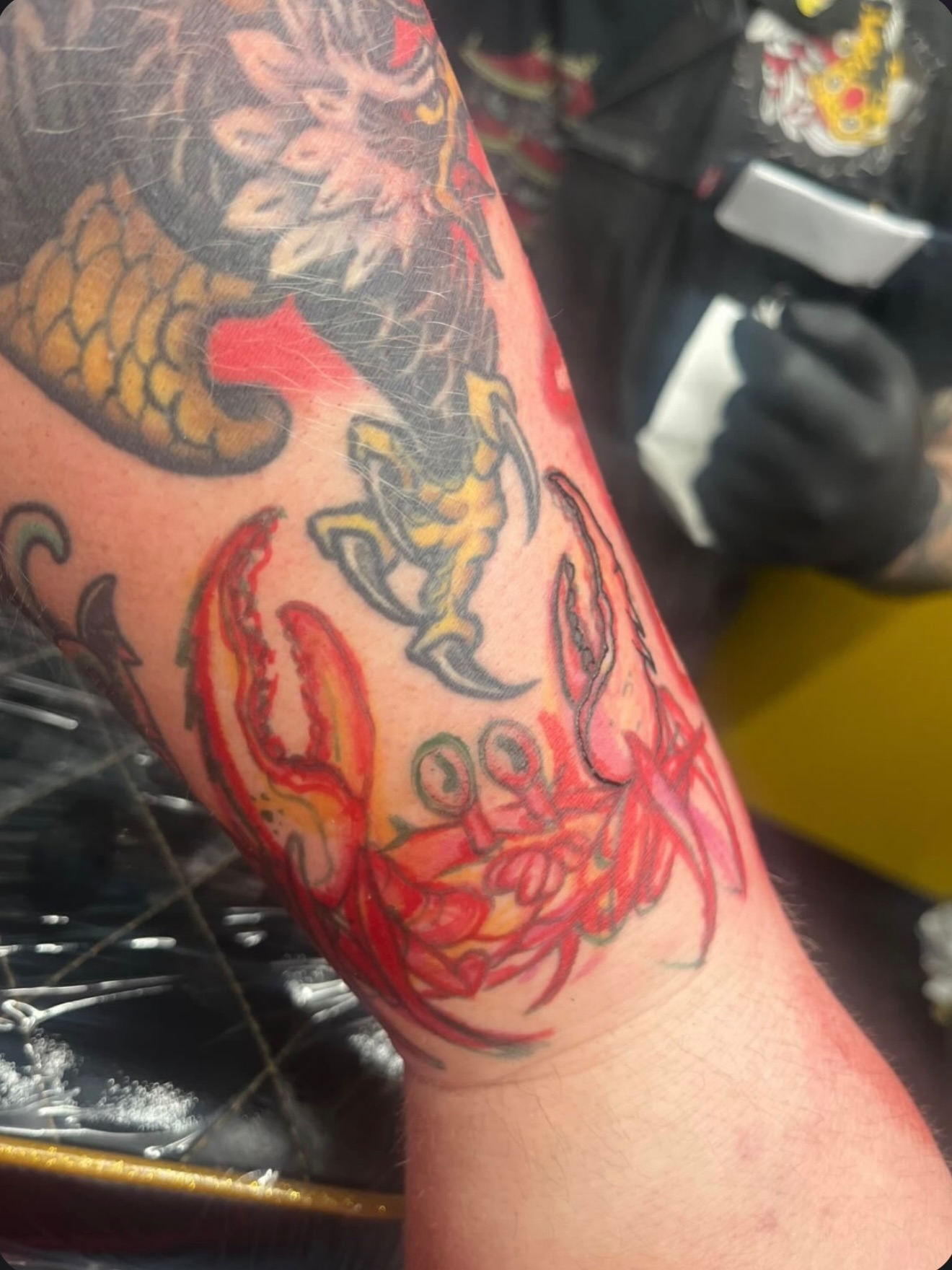 Lobster and dragon American traditional tattoo on the forearm by Chris Breuer, Asbury Park, New Jersey