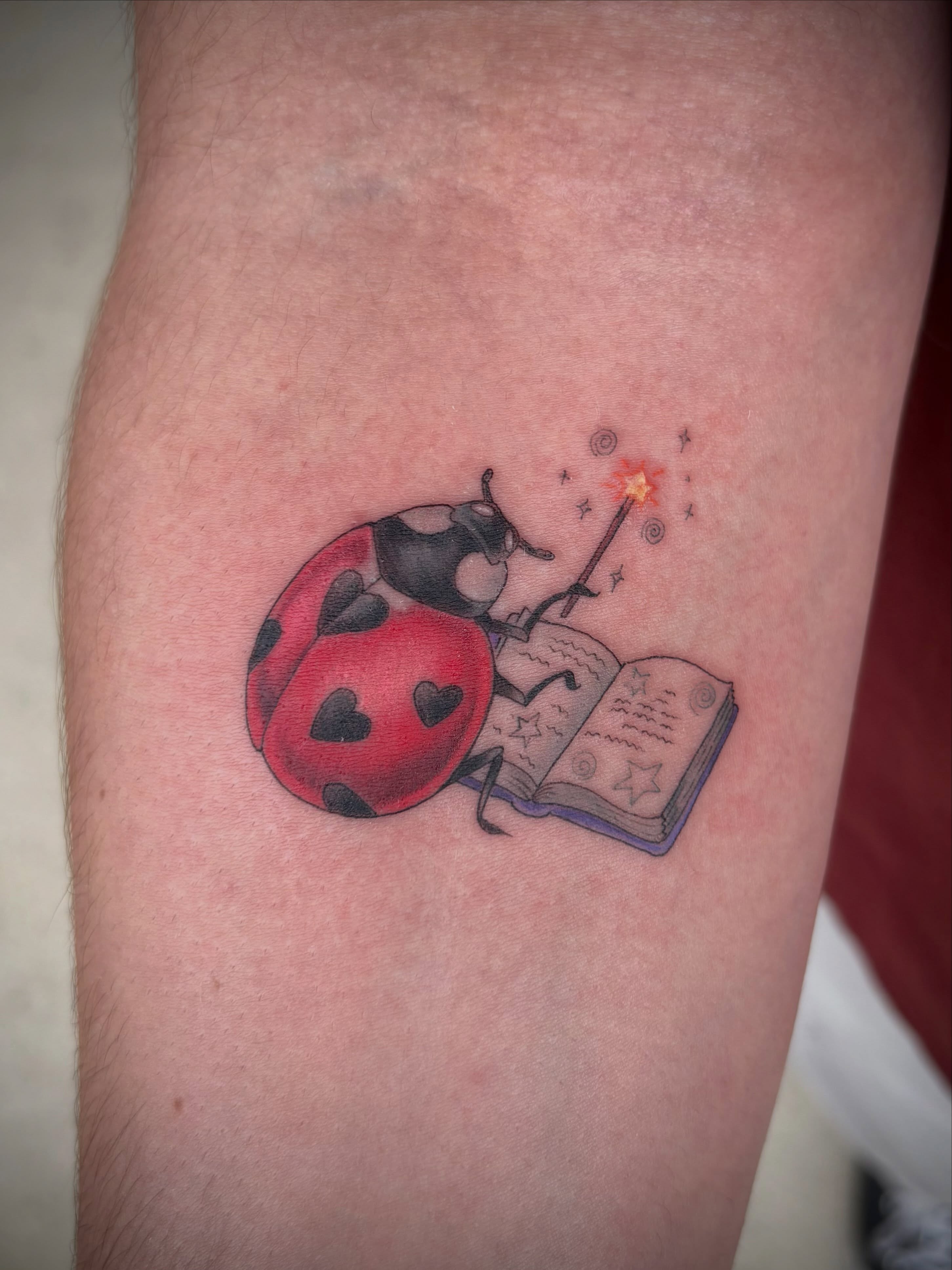 Ladybug reading book dotwork tattoo on the forearm by Miami Tattoo Artist π Mel Carrasco