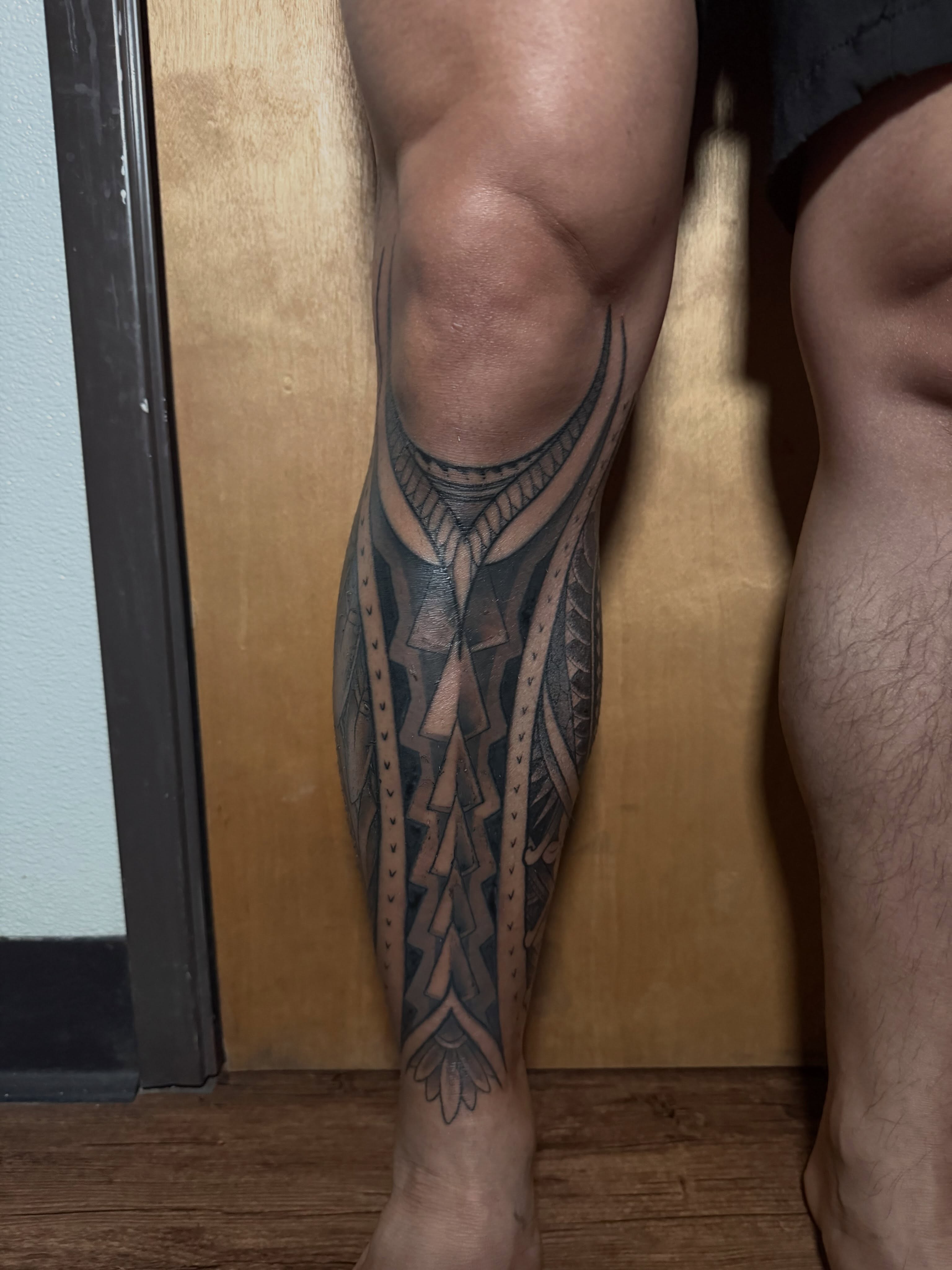 Tribal pattern tribal tattoo on the calf by Bob Simmons