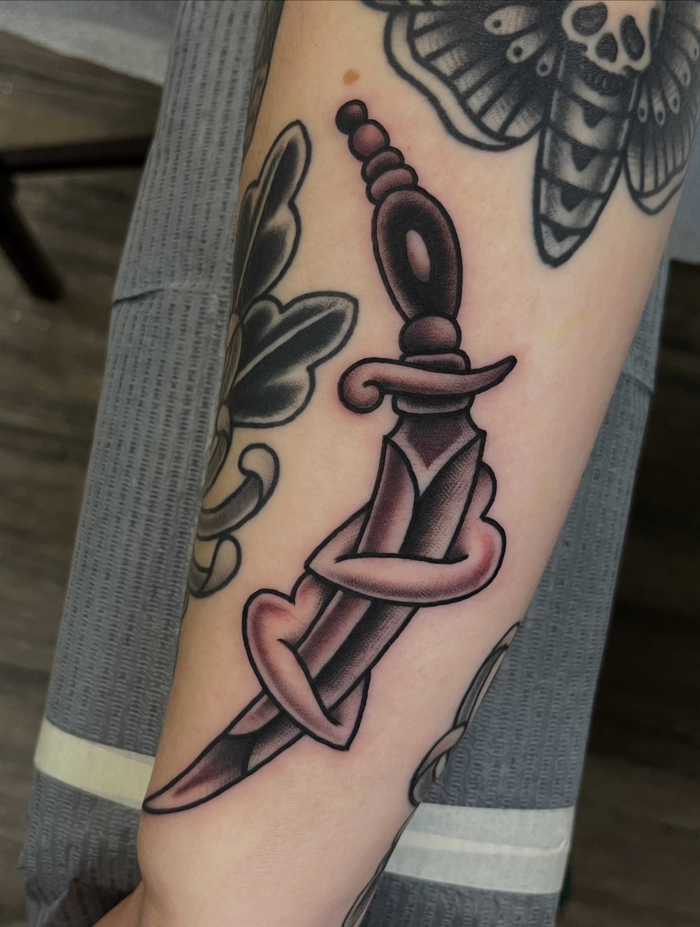 Knife and snake American traditional tattoo on the forearm by Anthony Tattooer, Seattle, Washington