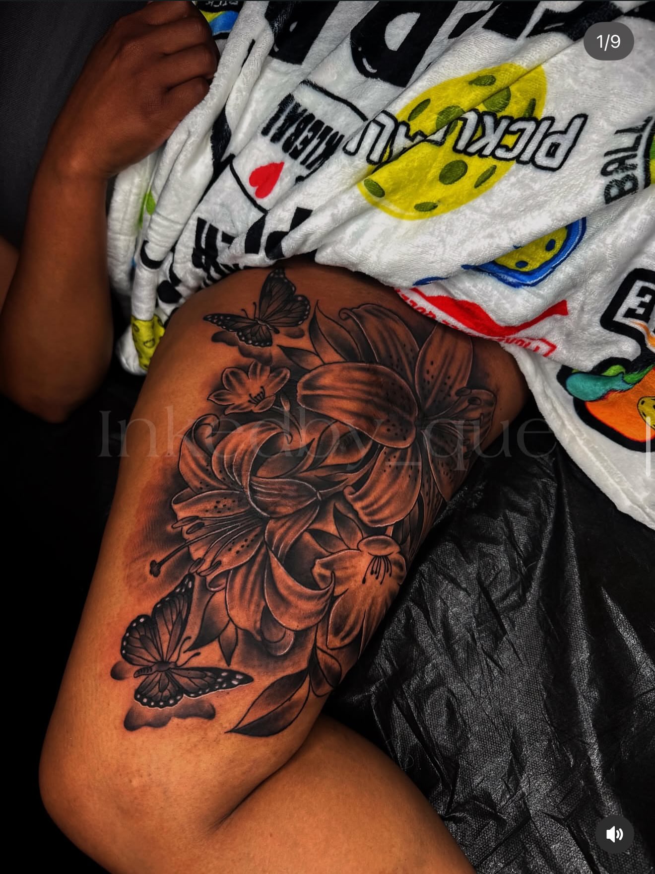 Lilies and butterflies realism tattoo on the thigh by Q⚜️