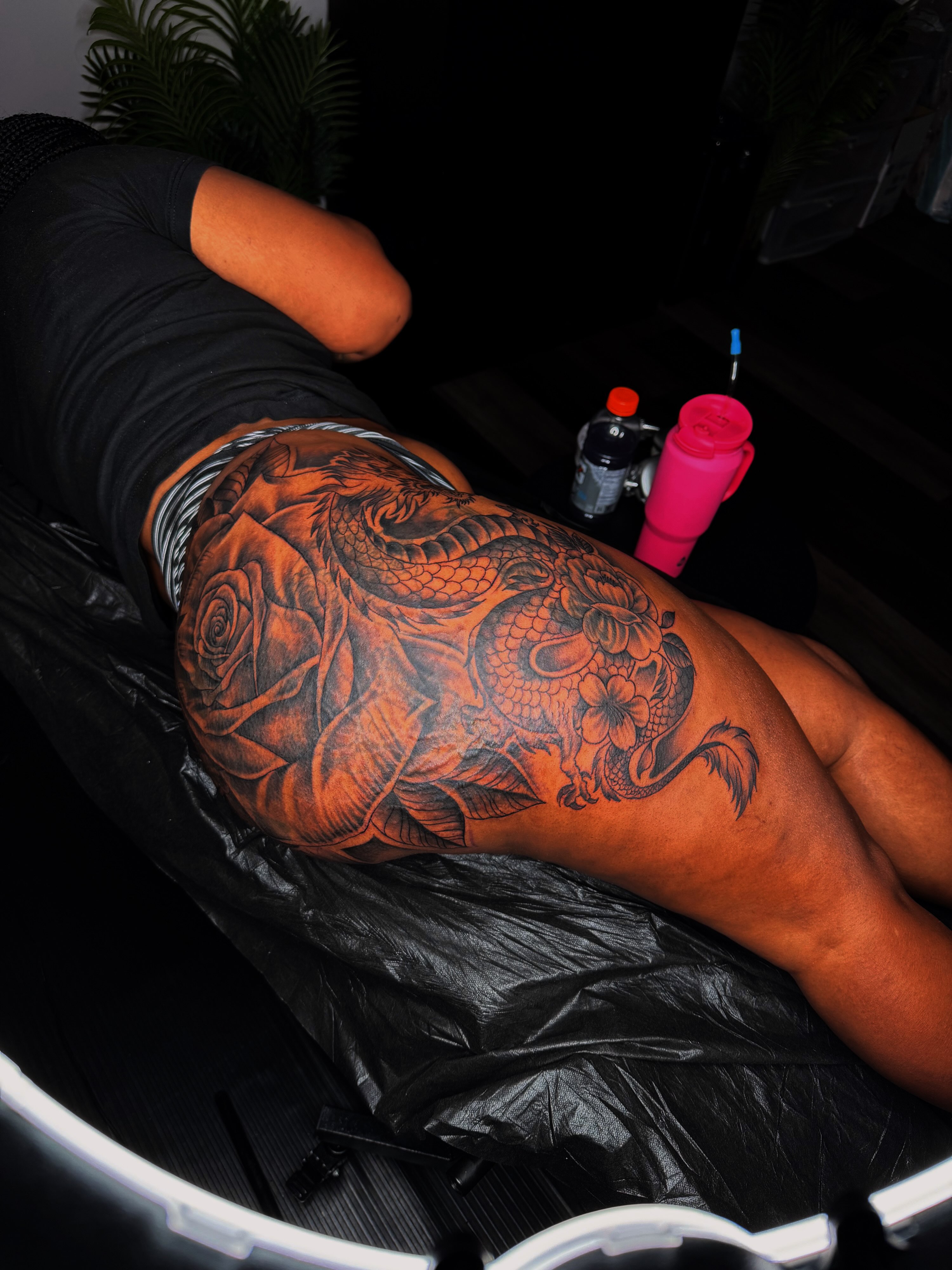 Dragon and rose realism tattoo on the thigh by Q⚜️