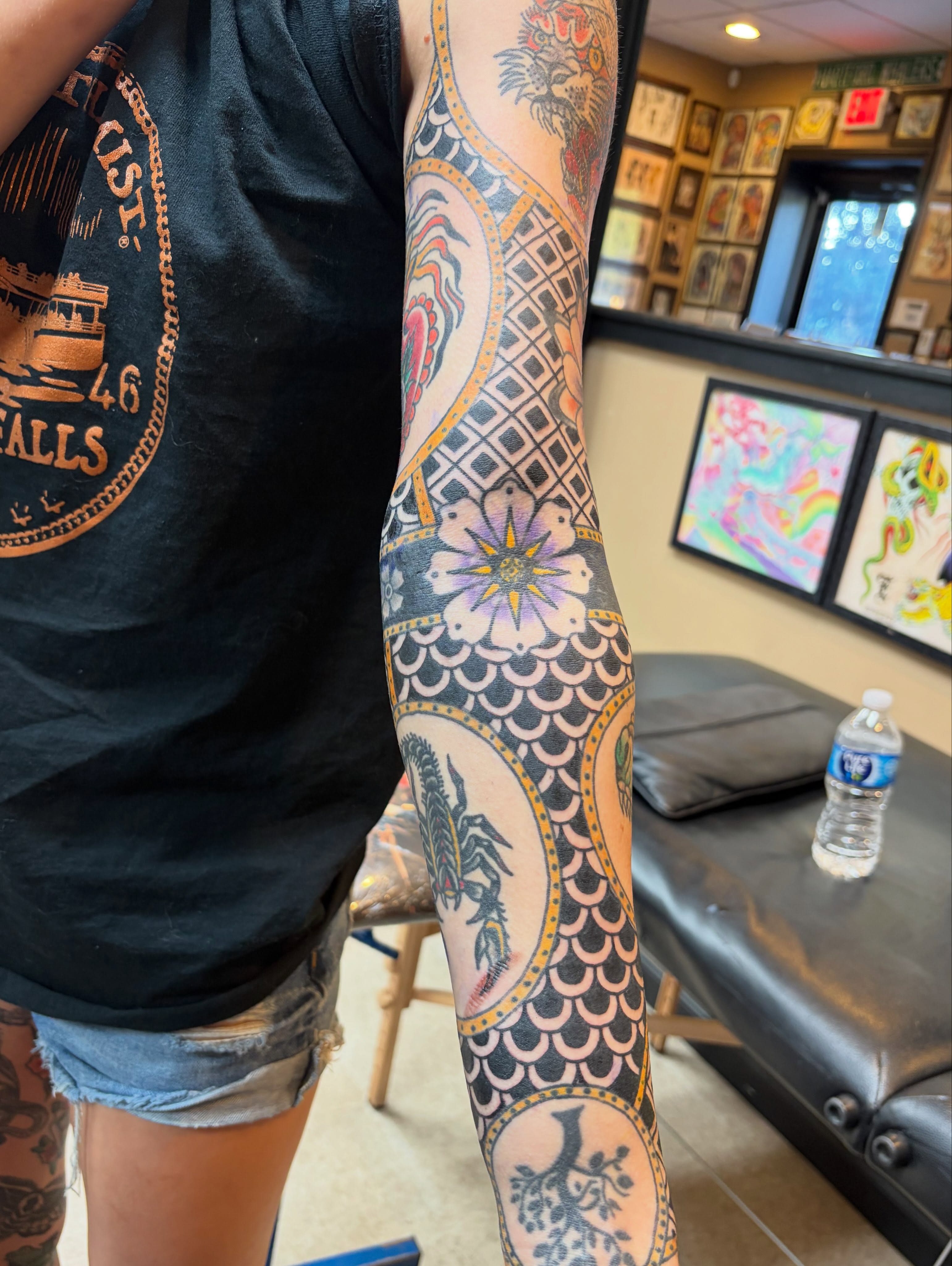 Floral and geometric patterns American traditional tattoo on the forearm by Scrap Iron Tattoos