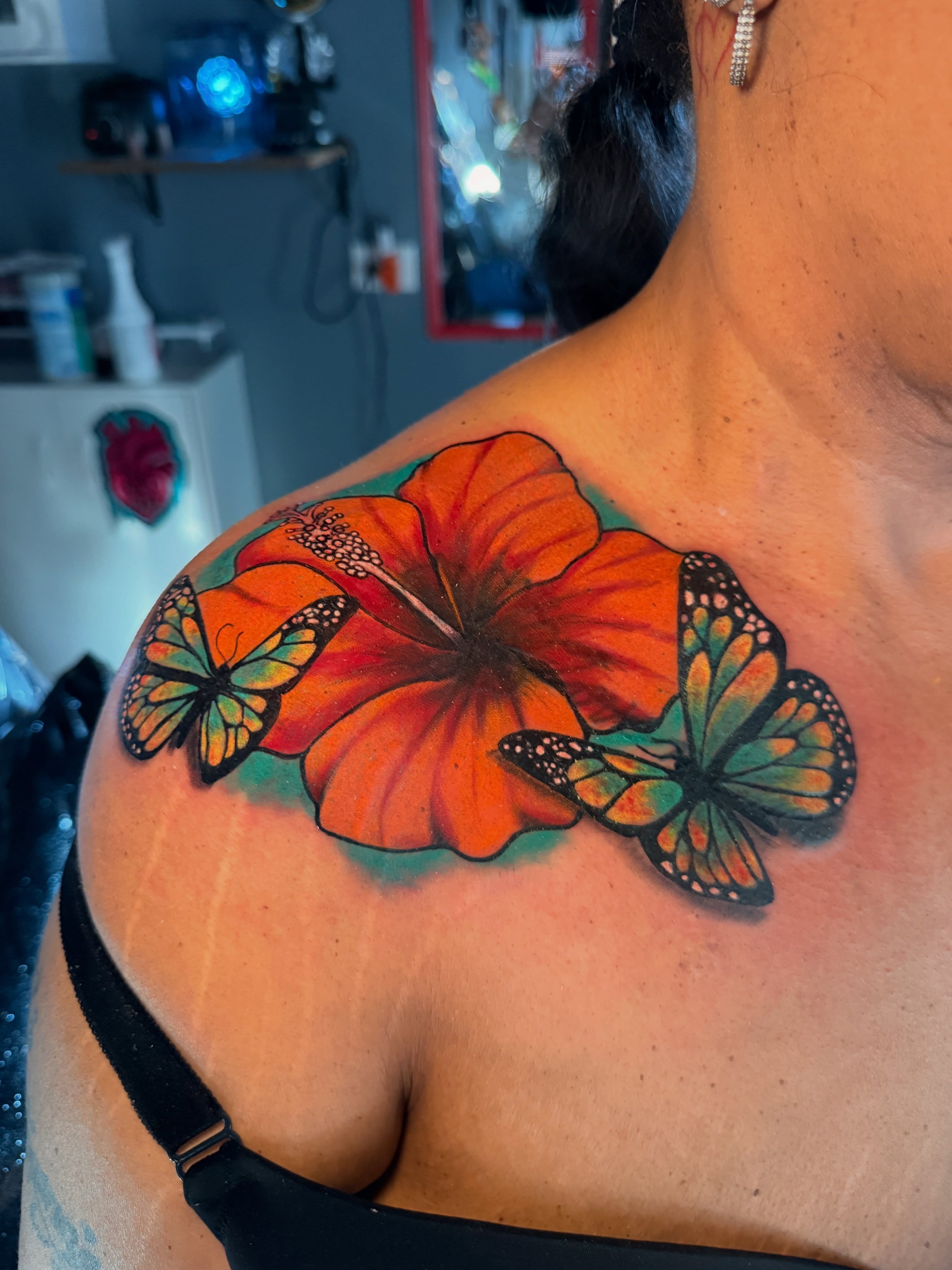 Hibiscus and butterflies realism tattoo on the shoulder by Butta