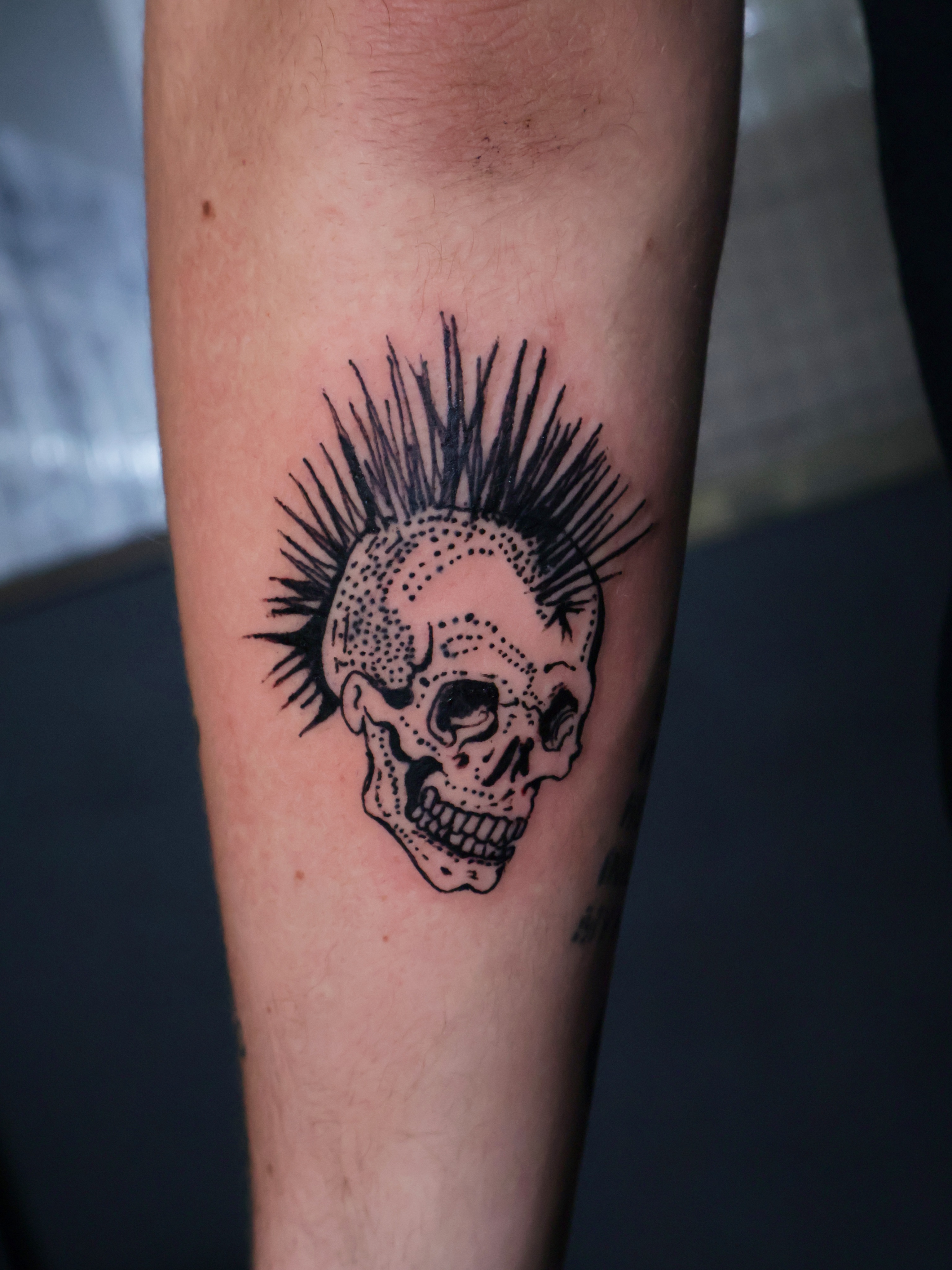 Punk skull dotwork tattoo on the forearm by Denis Du Preez, East Williamsburg, Brooklyn