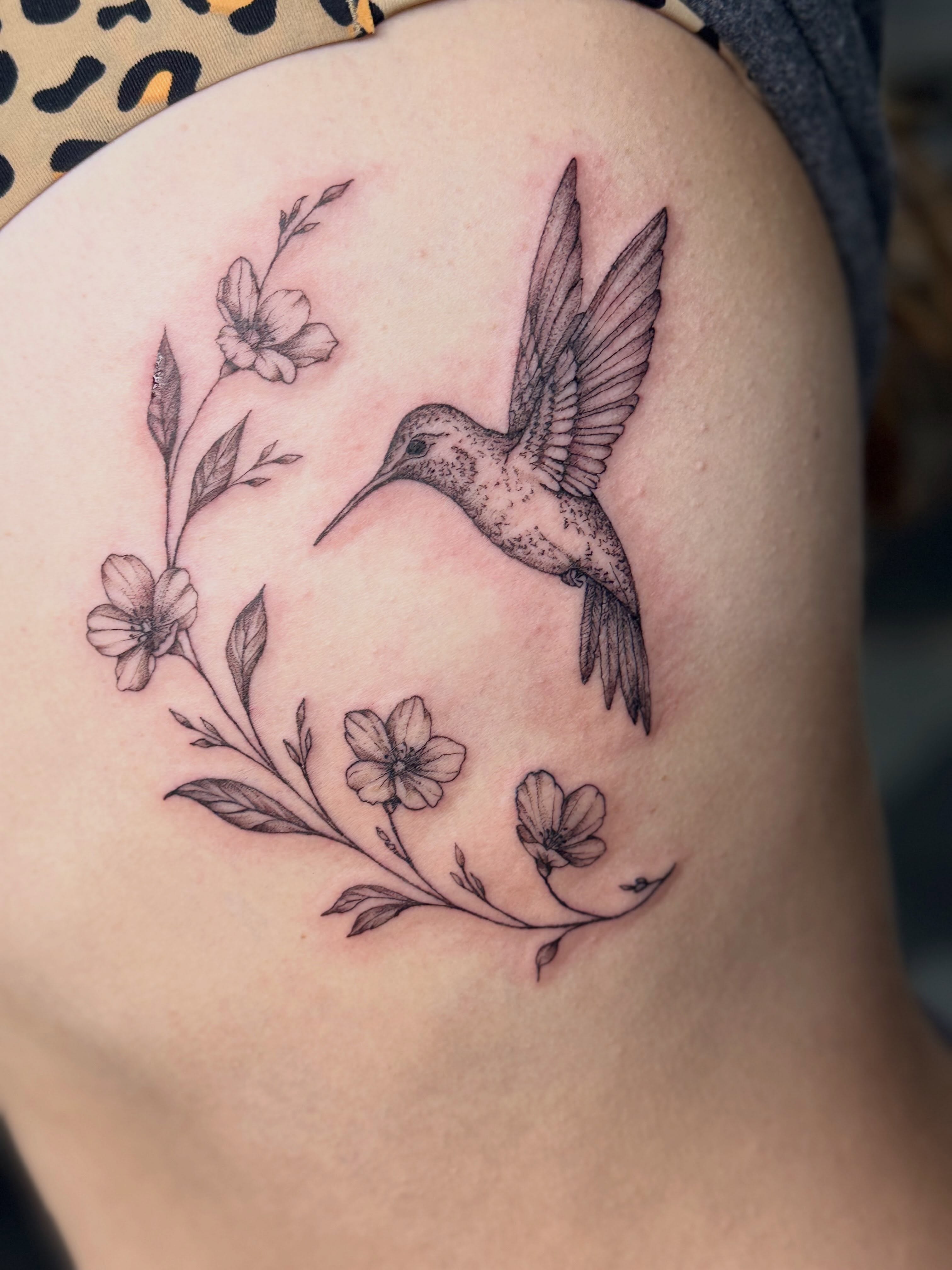 Hummingbird and flowers realism tattoo on the shoulder by Tetiana