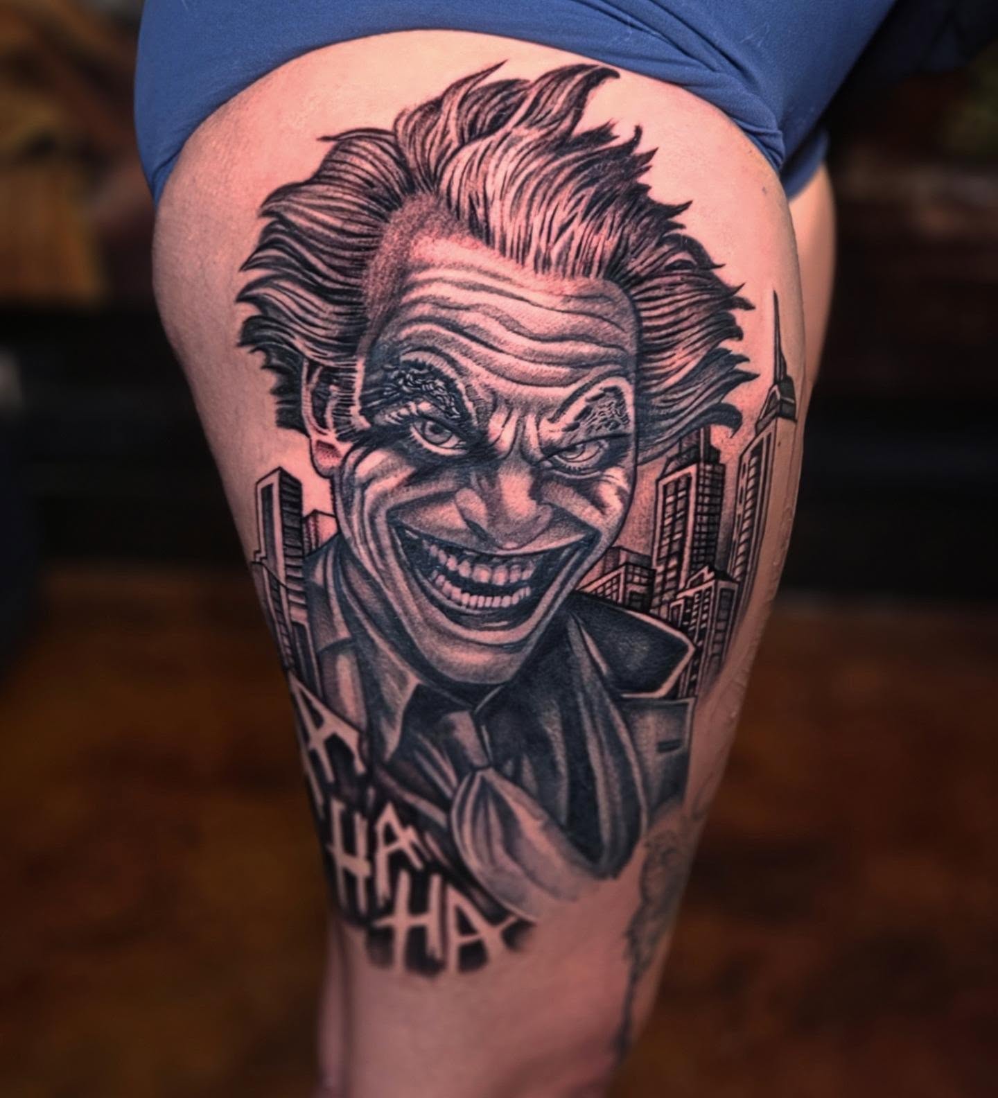 Joker black and grey tattoo on the thigh by Jack Jr Mora