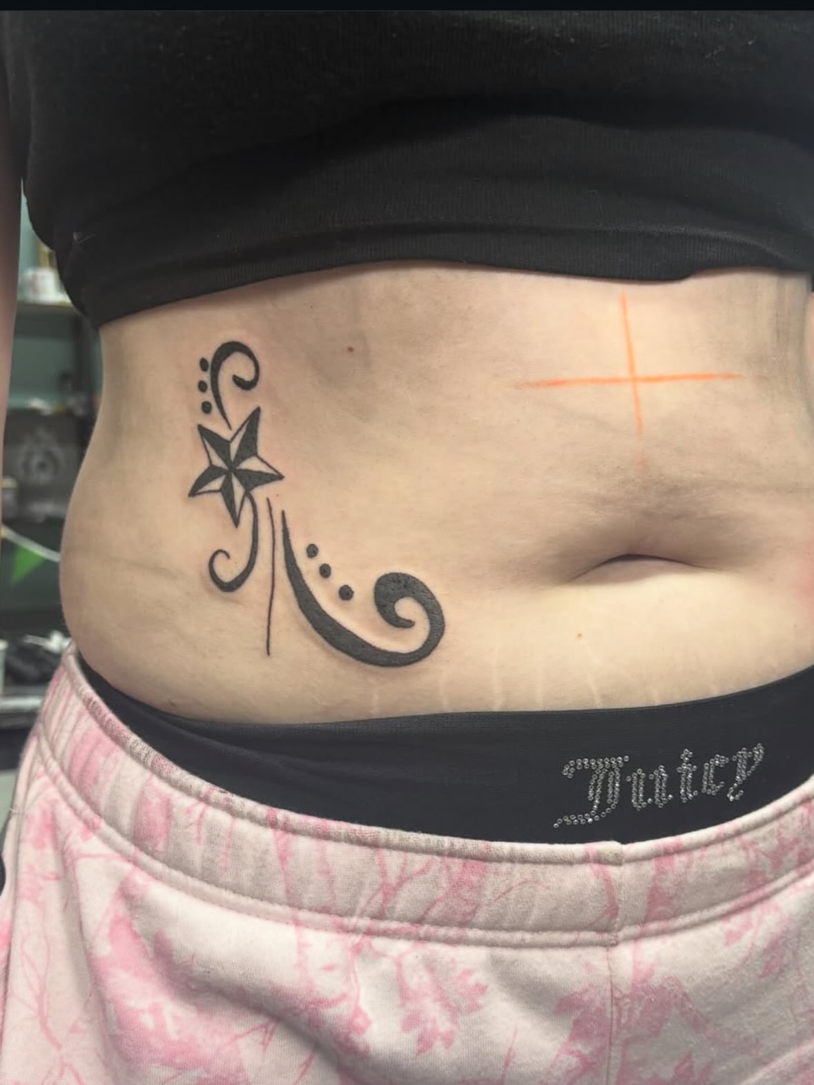 Star and swirls tribal tattoo on the torso by Joe ⋆₊⋆☢︎⁺₊⚠︎₊⋆