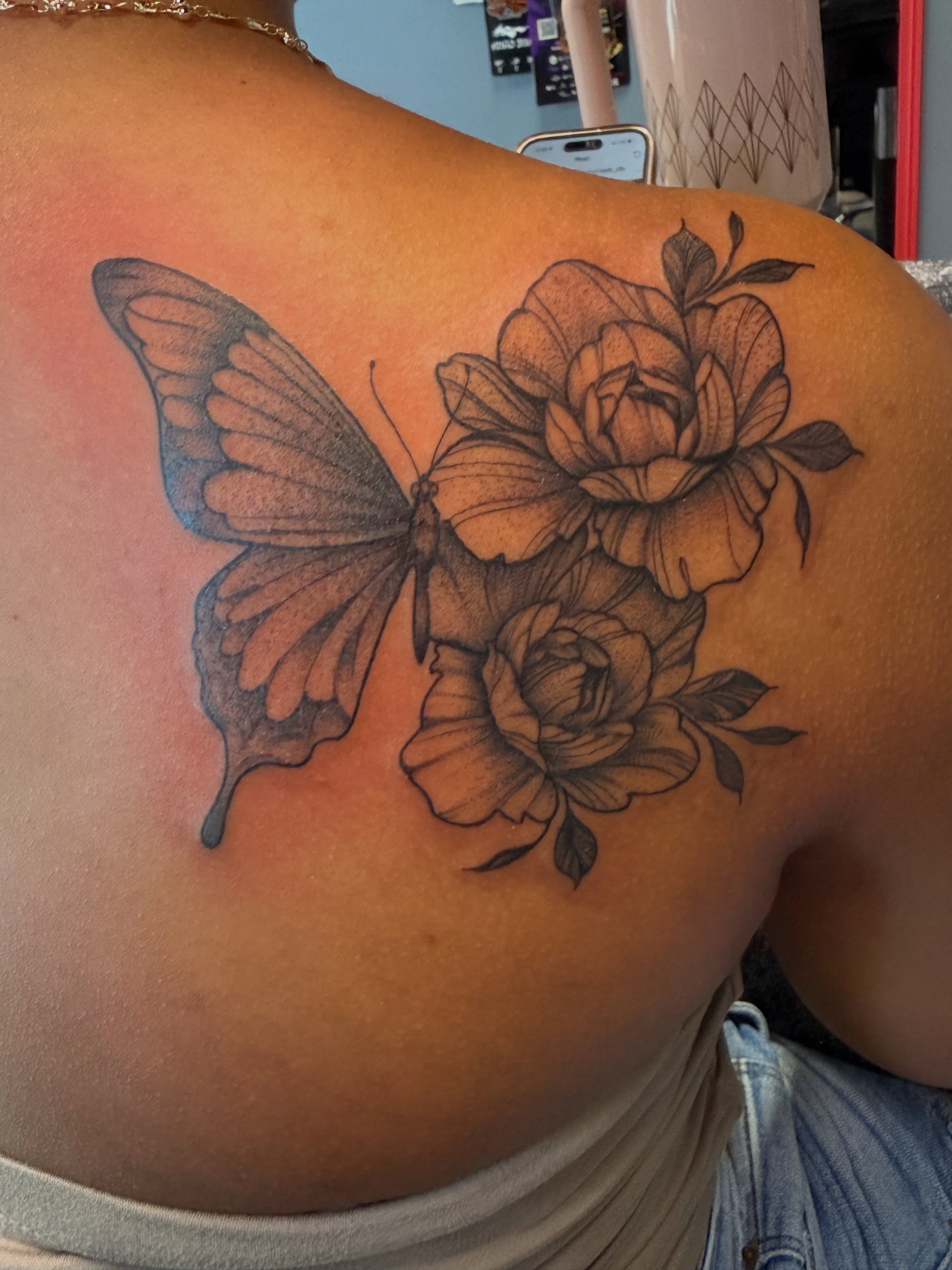 Butterfly and roses realism tattoo on the shoulder by Butta
