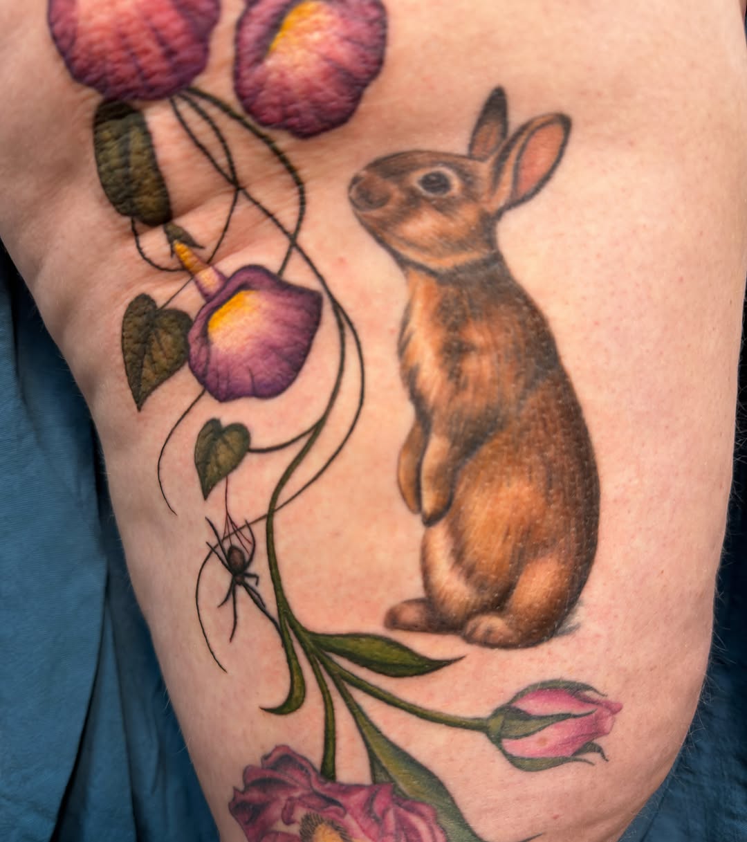 Rabbit and flowers realism tattoo on the forearm by @tatts_by_kat