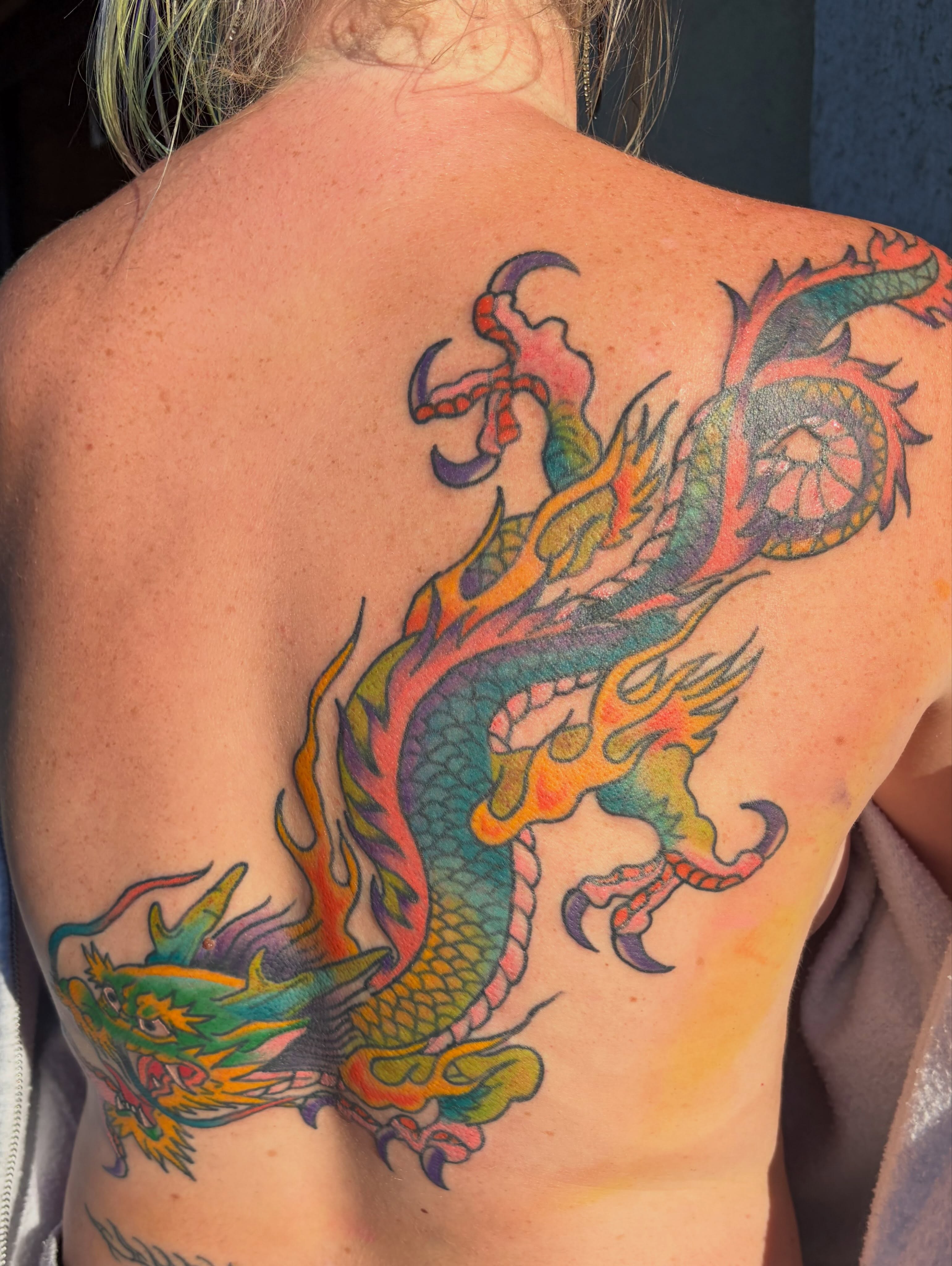 Dragon new school tattoo on the back by Scrap Iron Tattoos