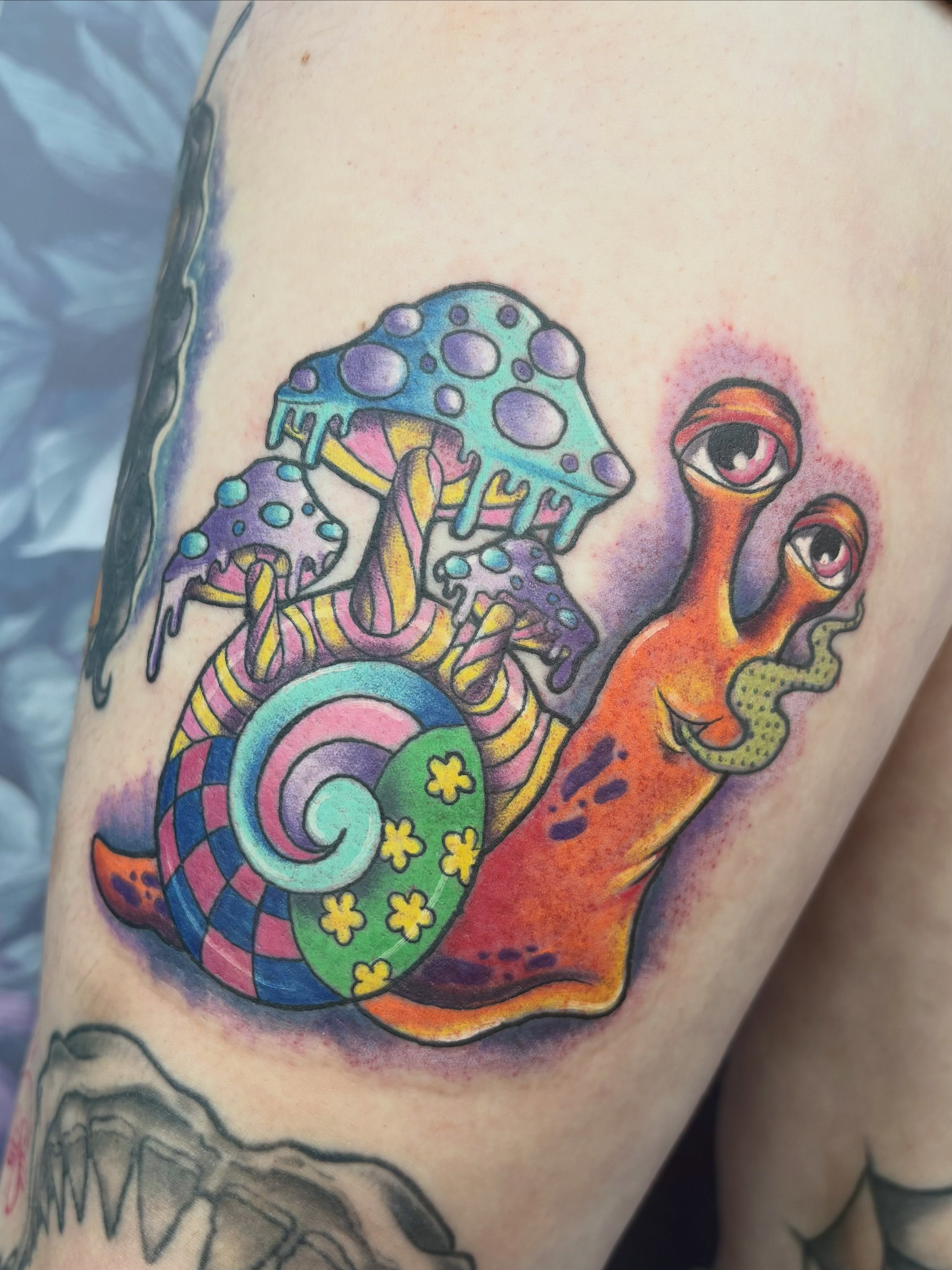 Snail with mushrooms new school tattoo on the thigh by Bre Alex
