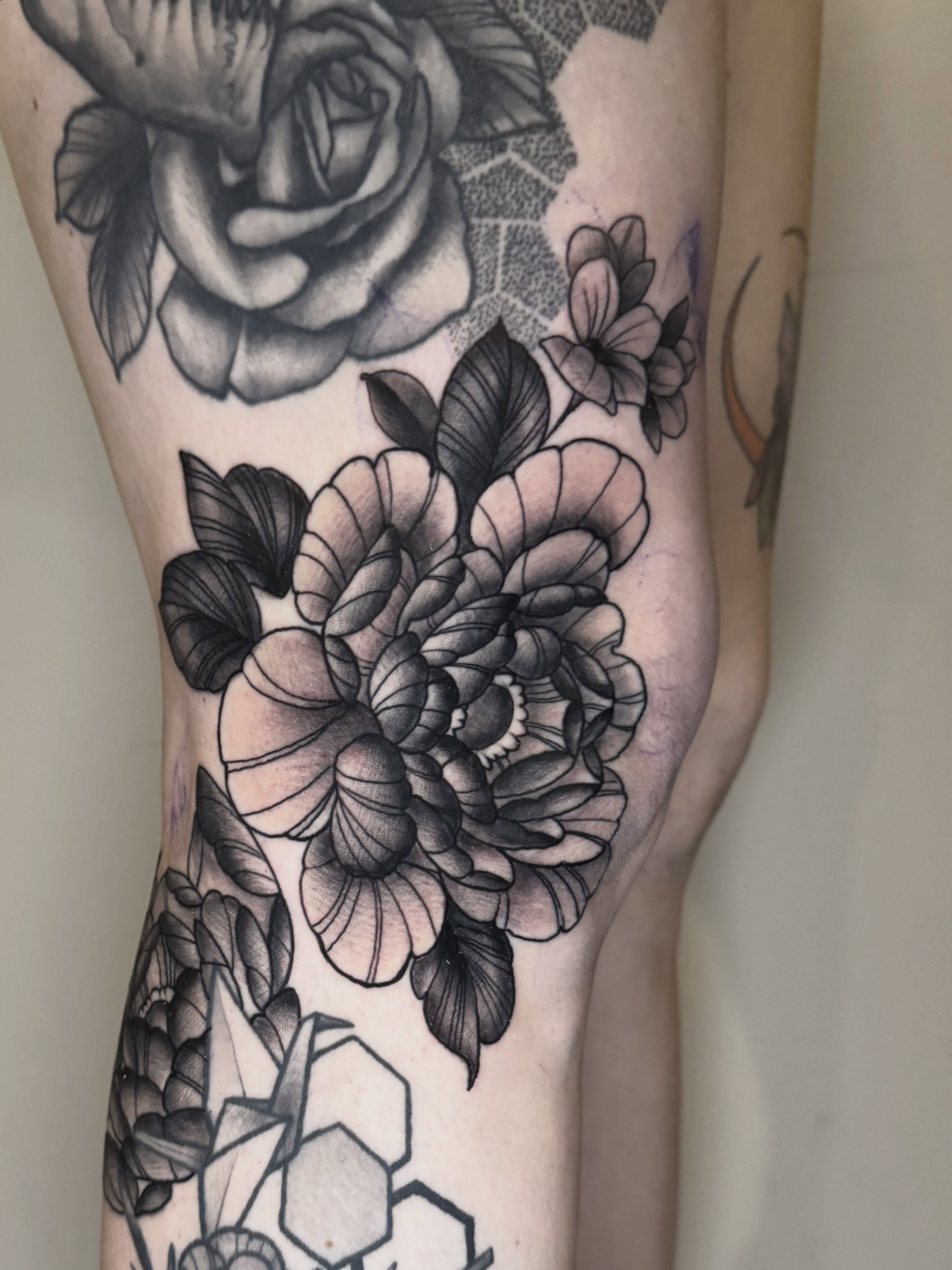 Floral bouquet geometric tattoo on the forearm by Mike Bean, Minneapolis, Minnesota