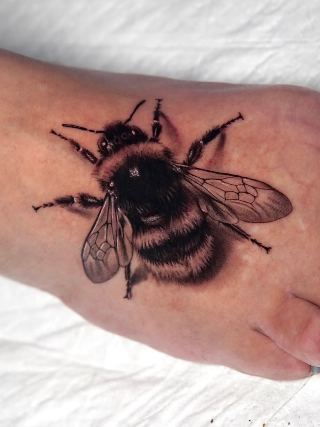 Bumblebee realism tattoo on the forearm by Marissa S., Lansing, Michigan