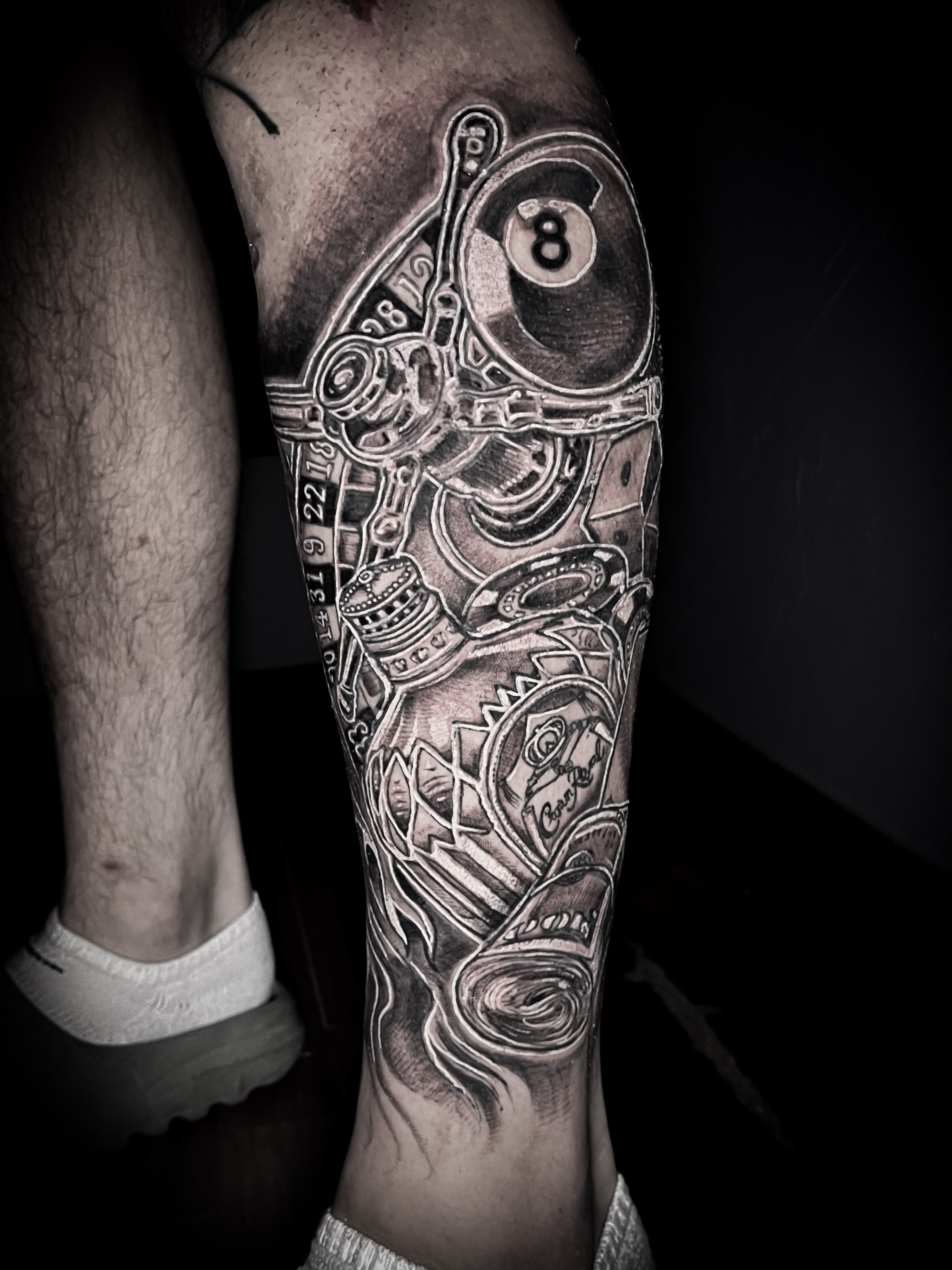 Billiard ball and mechanical elements realism tattoo on the forearm by Lindsay Fernandez, Colorado Springs, Colorado