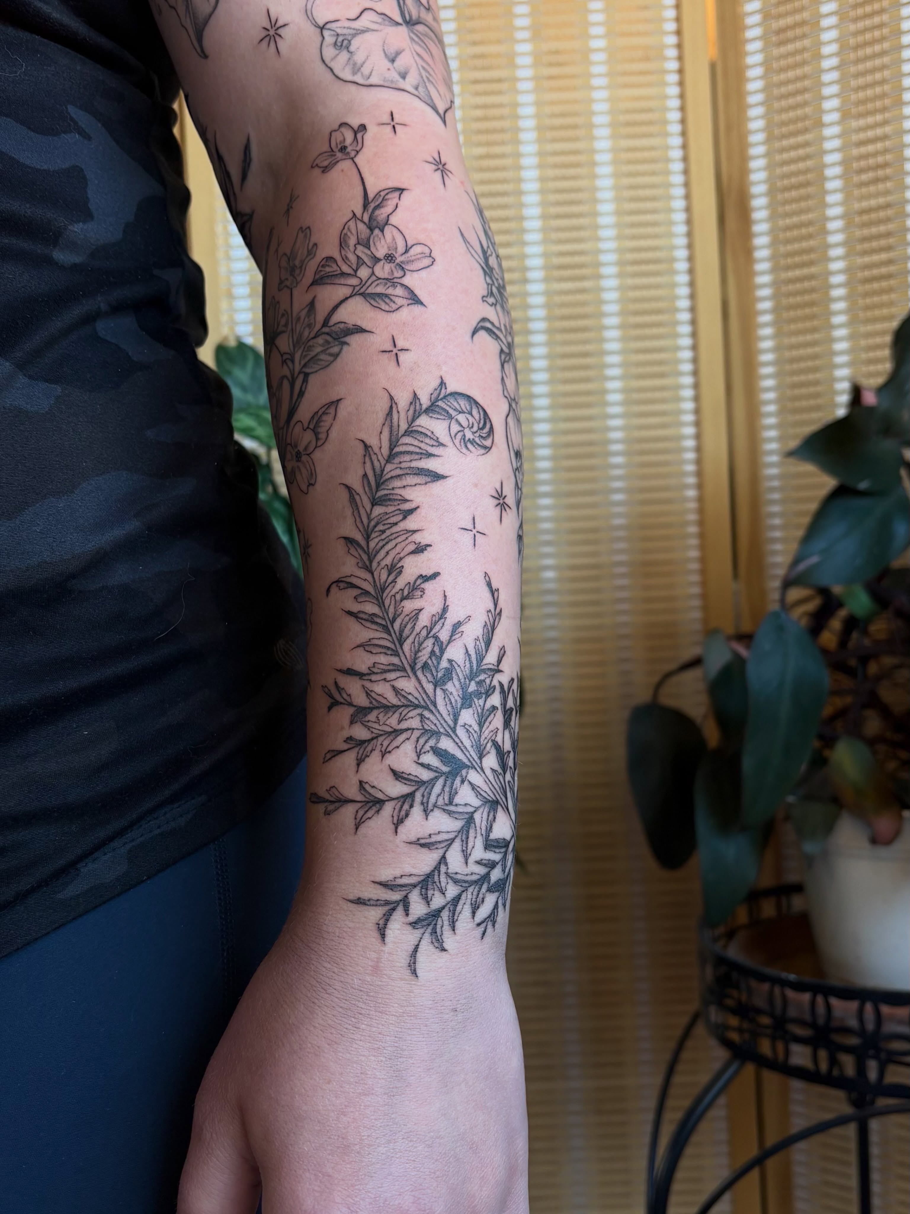 Floral and fern black and grey tattoo on the forearm by emery ♡ slc utah tattoo artist