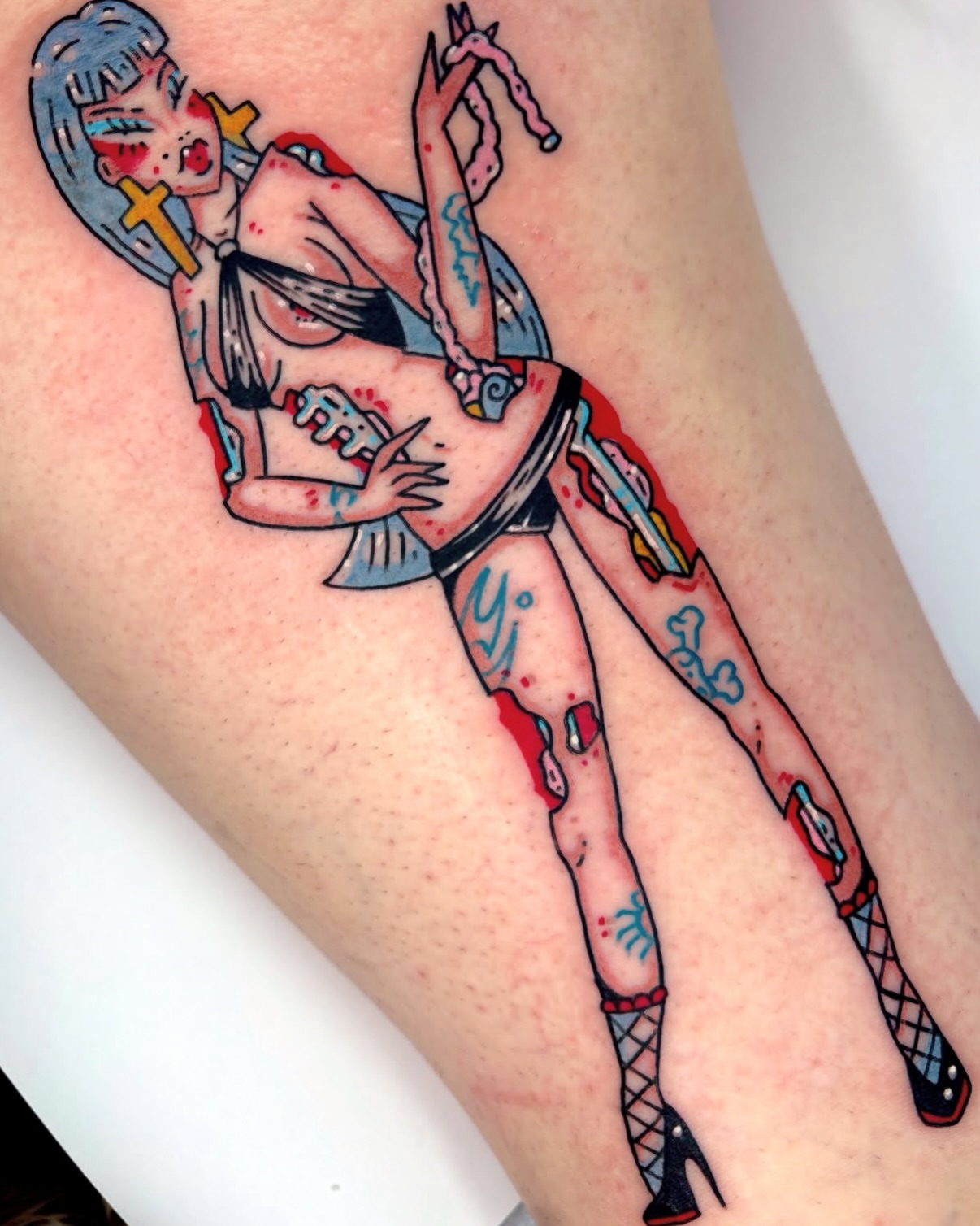 Pin-up girl American traditional tattoo on the thigh by Bella