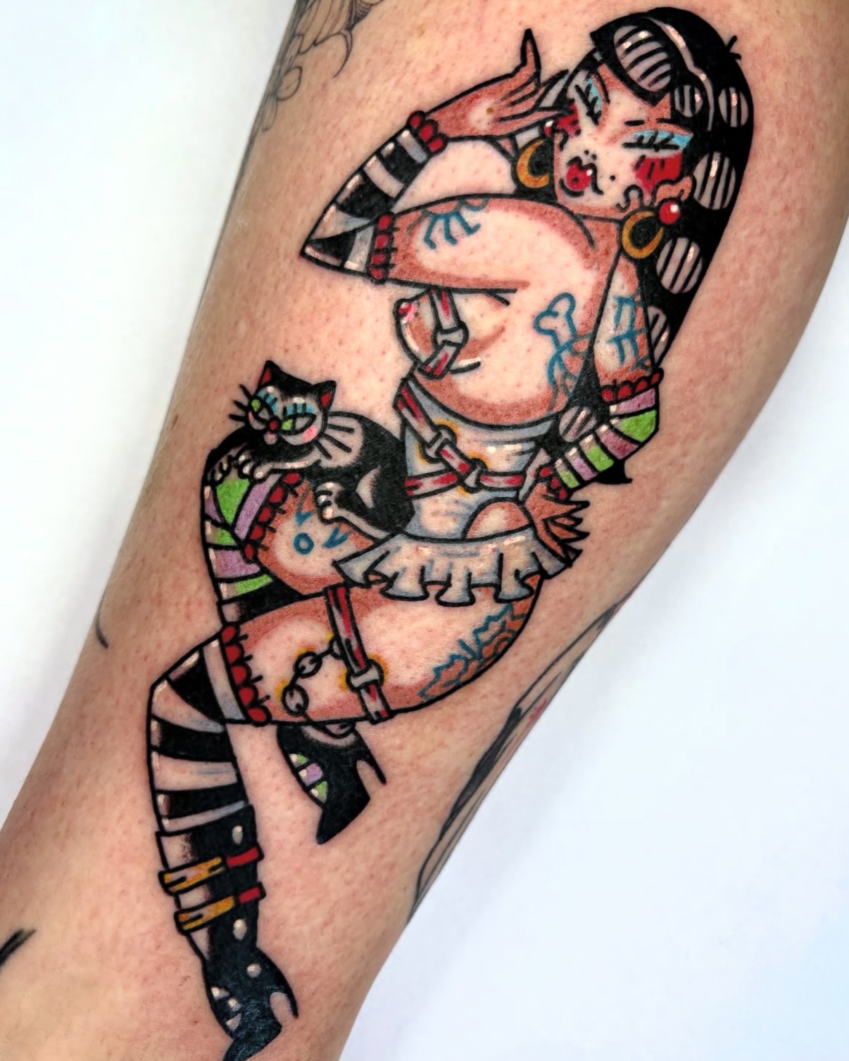 Woman and cat American traditional tattoo on the forearm by Bella