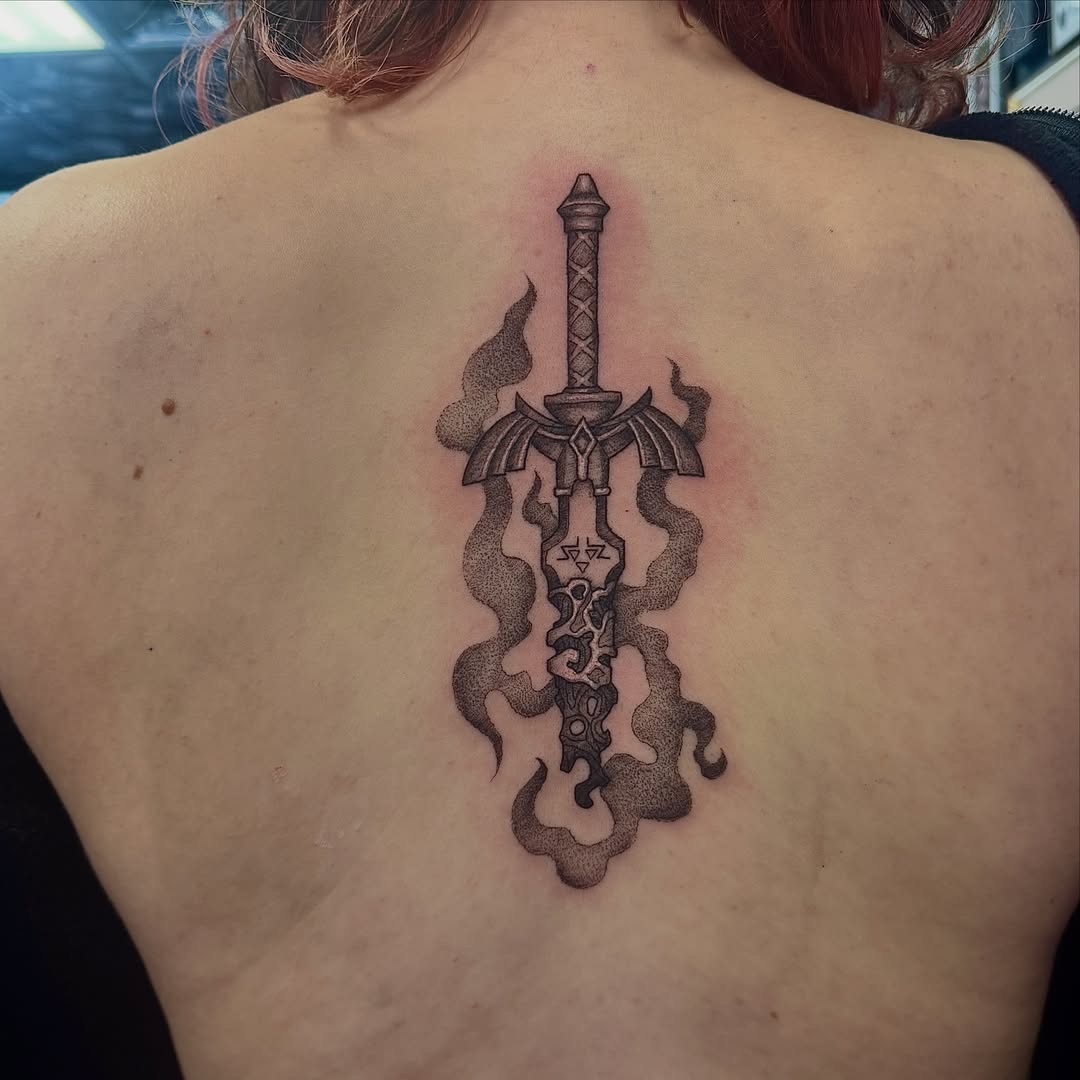 Sword dotwork tattoo on the back by Kat Bennett