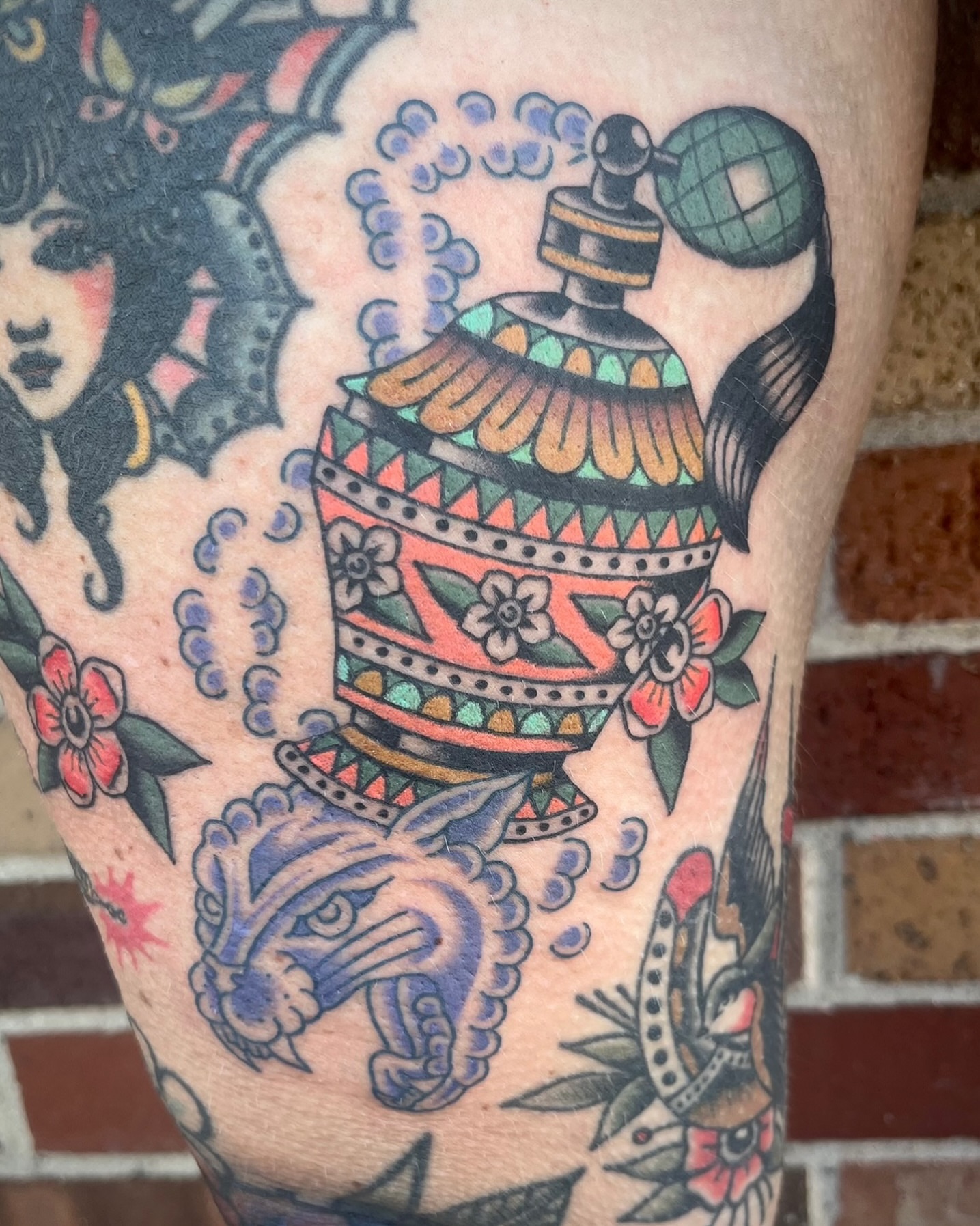 Perfume bottle American traditional tattoo on the forearm by Tiffani Thompson, San Diego, California