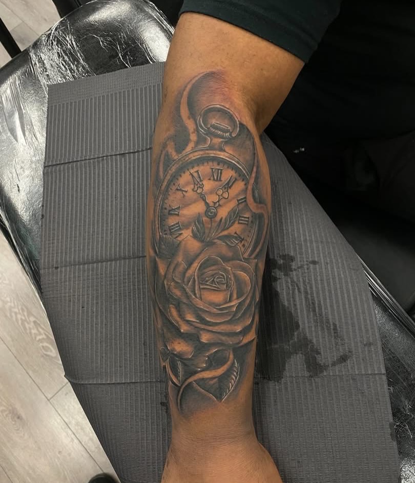 Clock and rose realism tattoo on the forearm by Israel Jacob Woehler