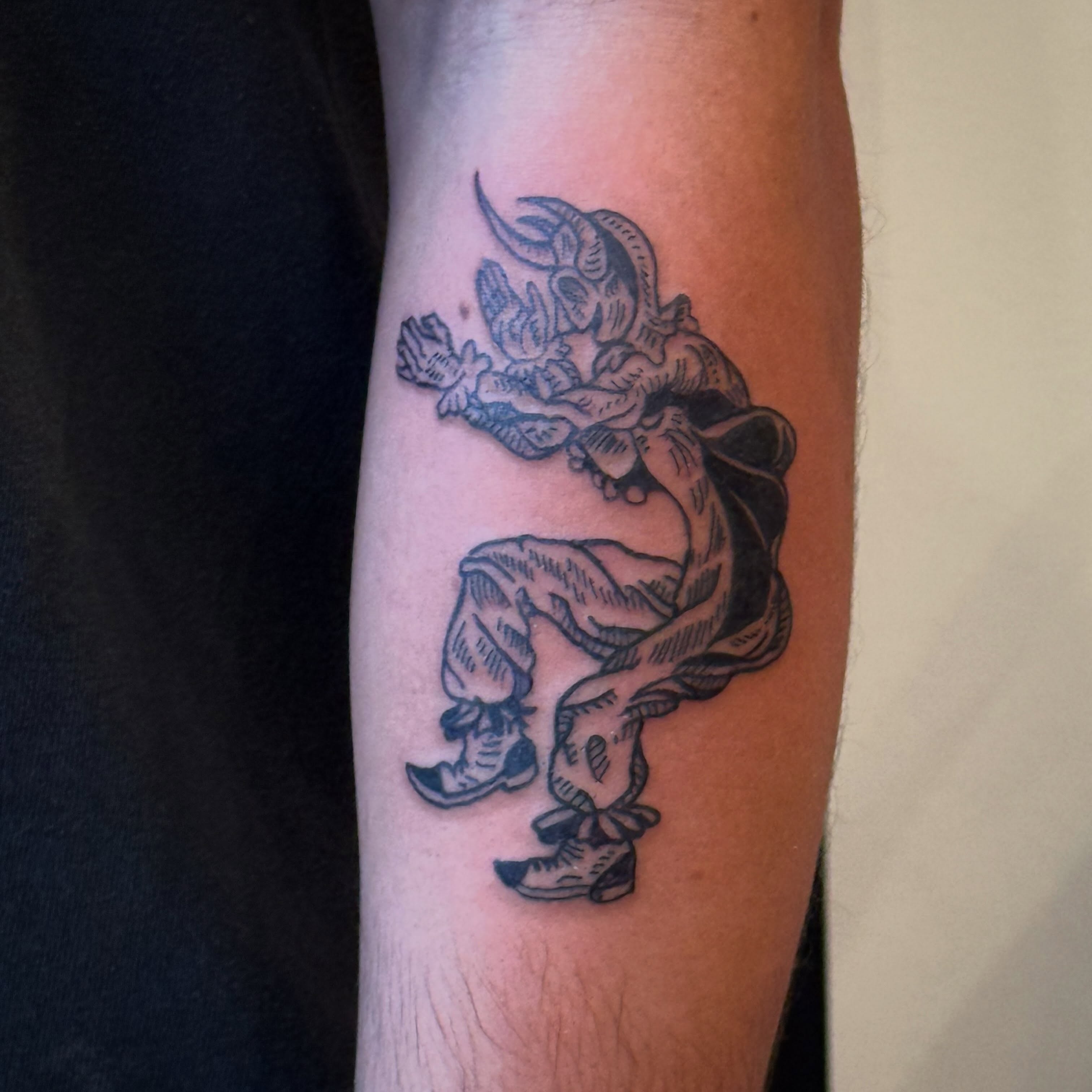 Demon American traditional tattoo on the forearm by Eric Guntor, Philadelphia, Pennsylvania