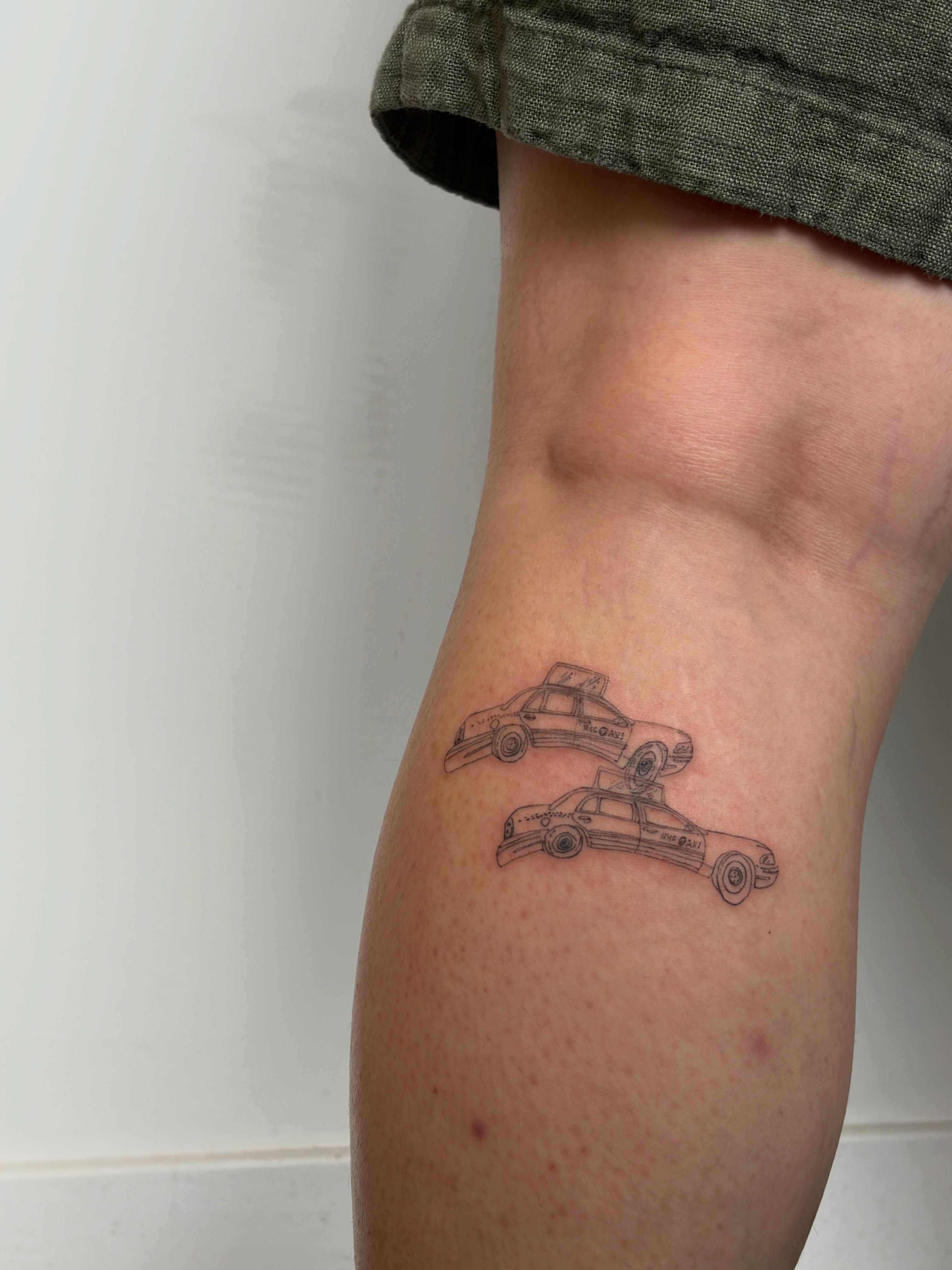 Police cars black and grey tattoo on the thigh by annie’s tattoos ⭐꩜ .ᐟ