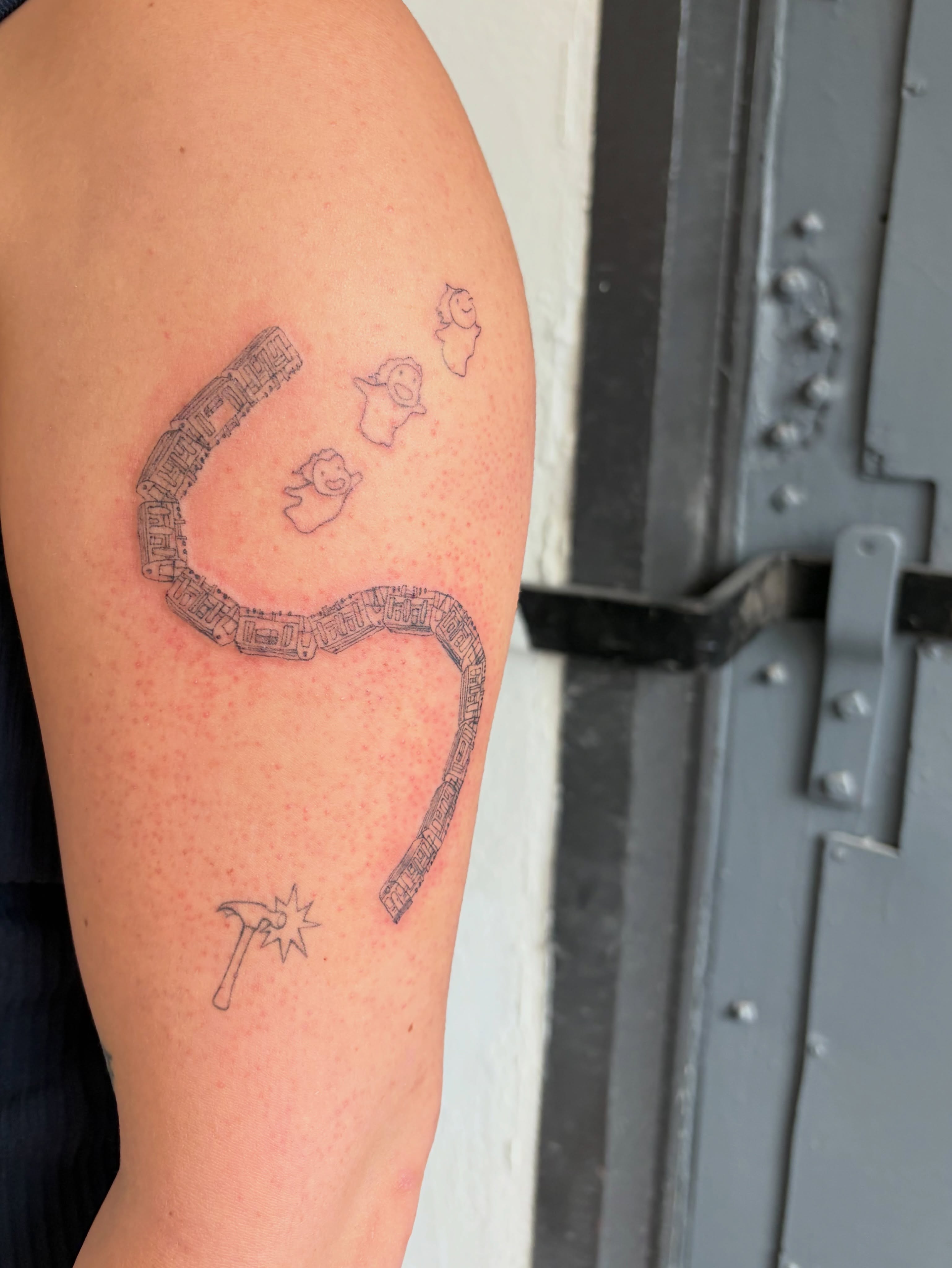Cityscape with birds black and grey tattoo on the upper arm by annie’s tattoos ⭐꩜ .ᐟ