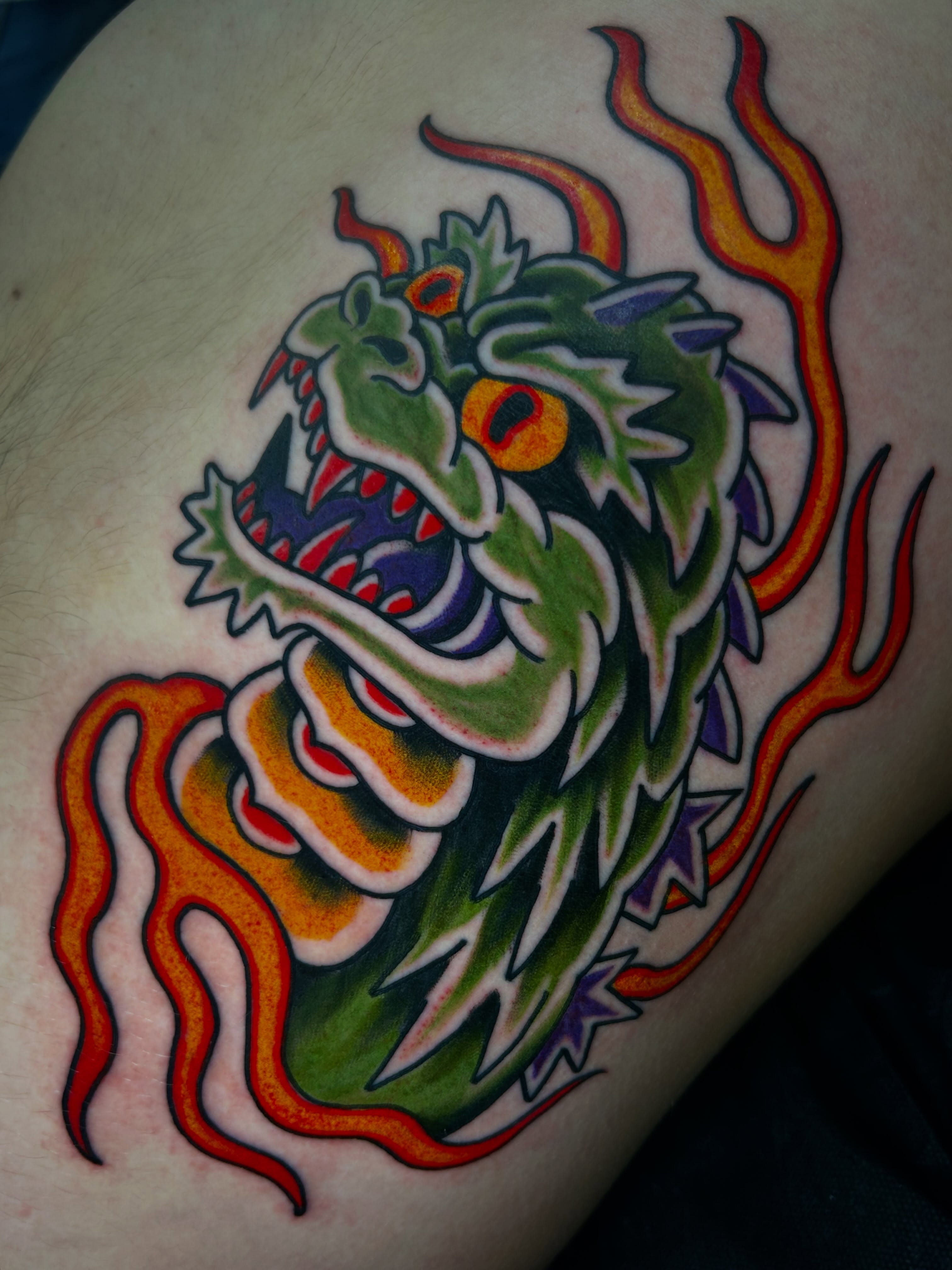 Dragon American traditional tattoo on the thigh by Katie Dexter, Des Moines, Iowa